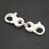 Faith double figure 8 clasp - shiny shown on dark background