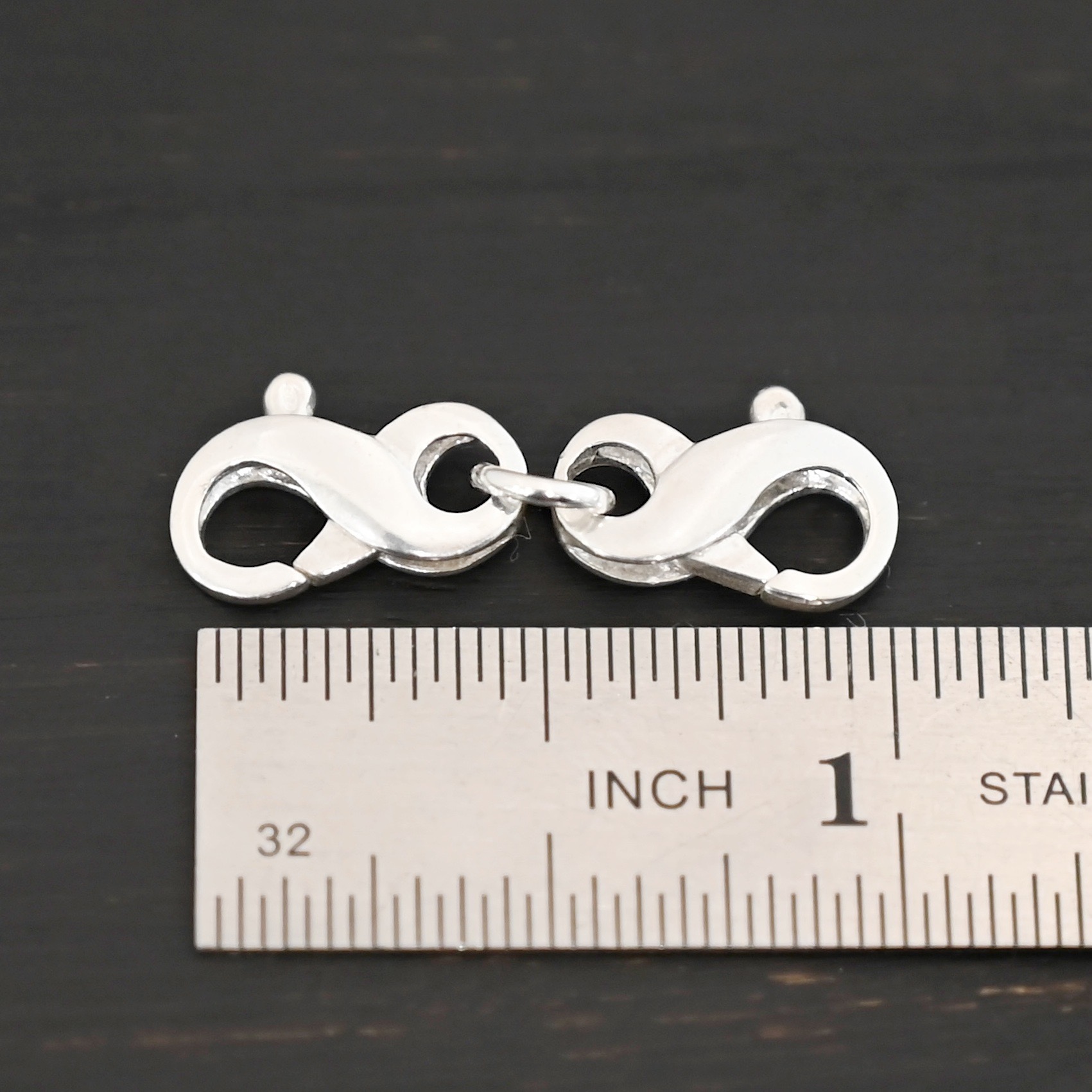 Faith double figure 8 clasp - shiny shown by ruler