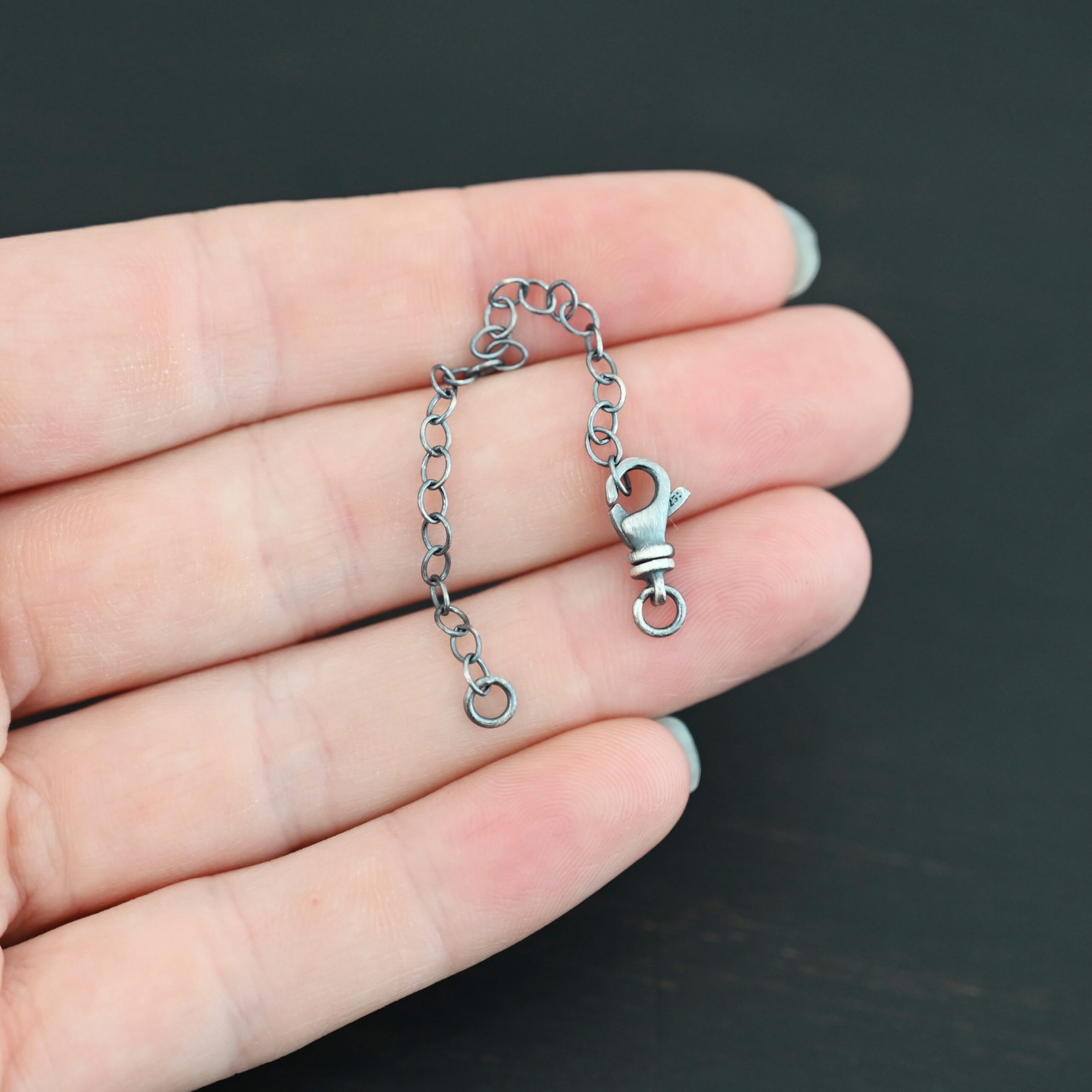 Eli Extension - oxidized shown in hand