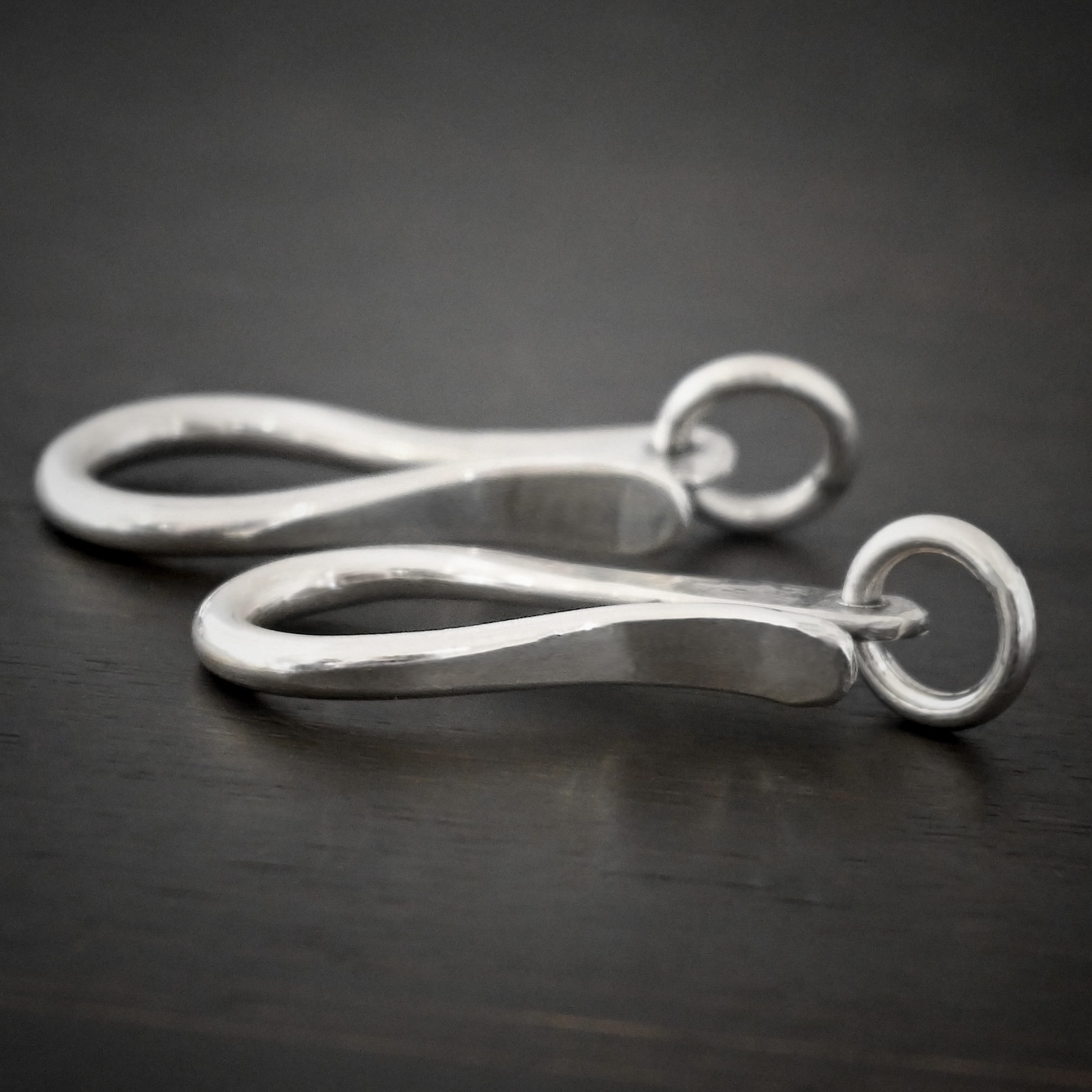 Harrison Hook Clasp - shiny Harrison Hook Clasp - shiny shown on dark background