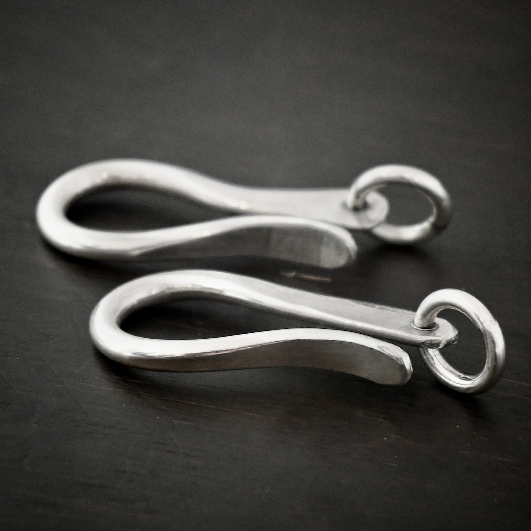 Harrison Hook Clasp - shiny Harrison Hook Clasp - shiny shown on dark background