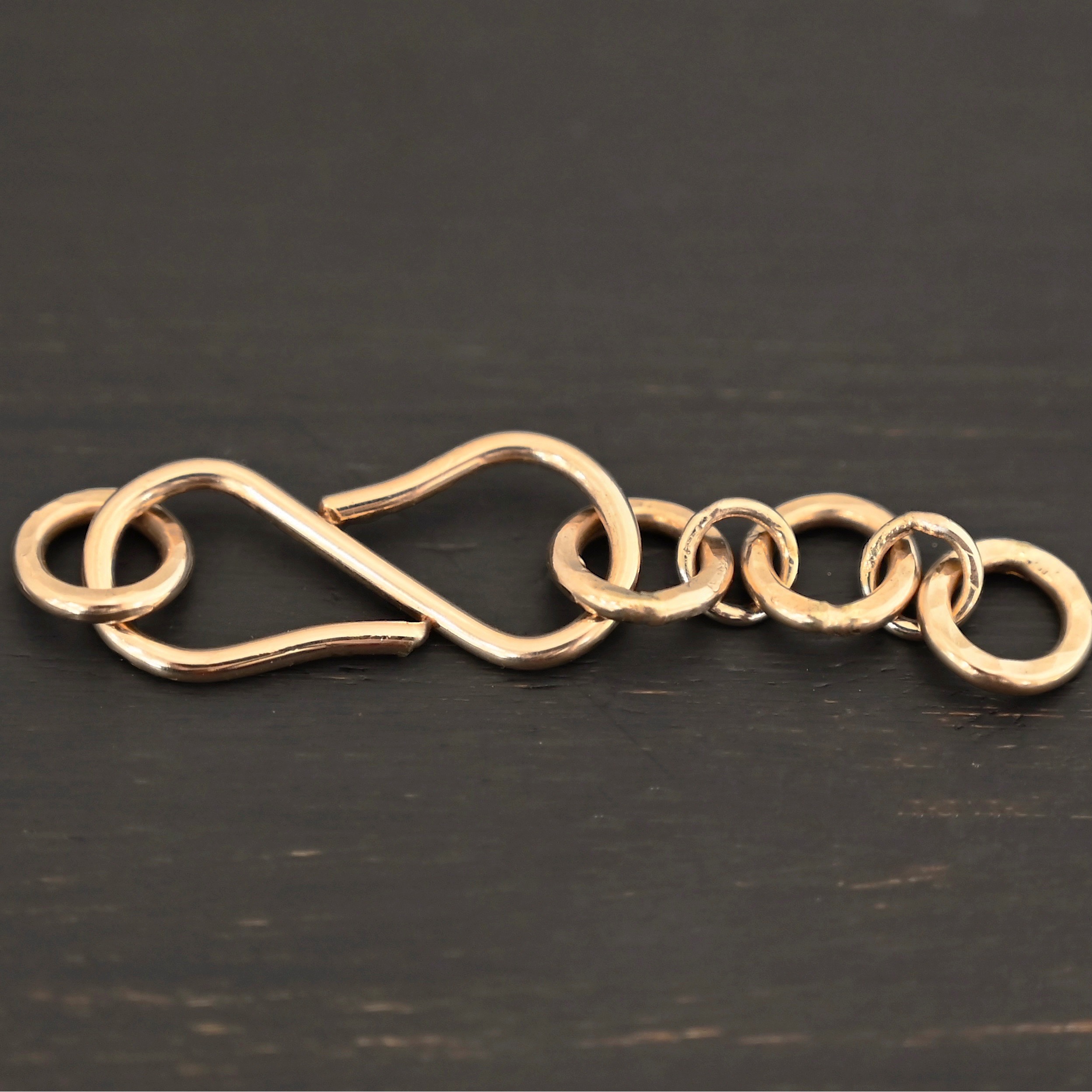 Ezra Extension - 14k Gold Filled shown on dark background