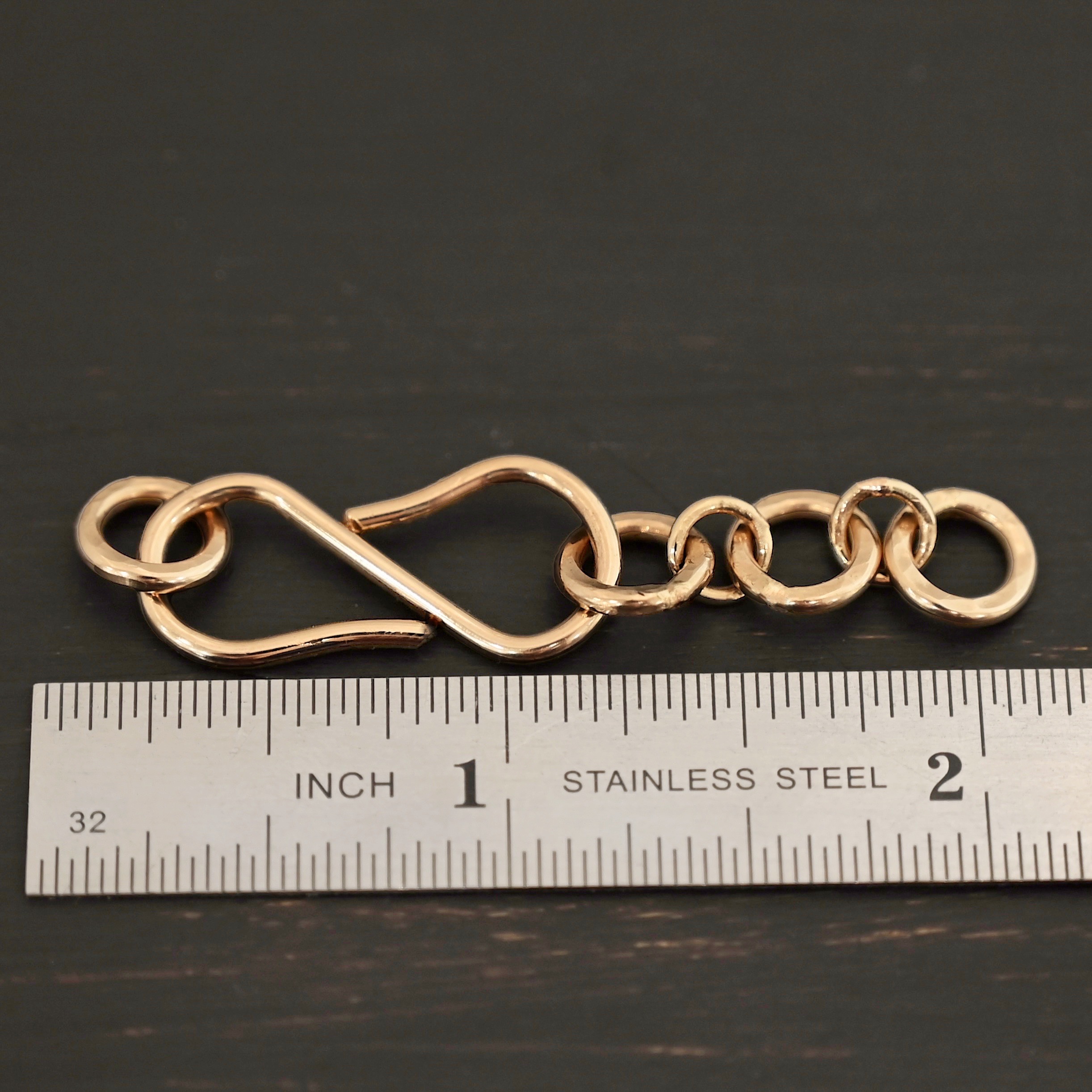 Ezra Extension - 14k Gold Filled shown by ruler