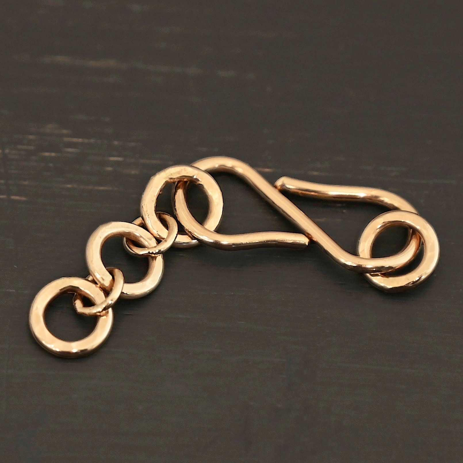 Ezra Extension - 14k Gold Filled shown on dark background