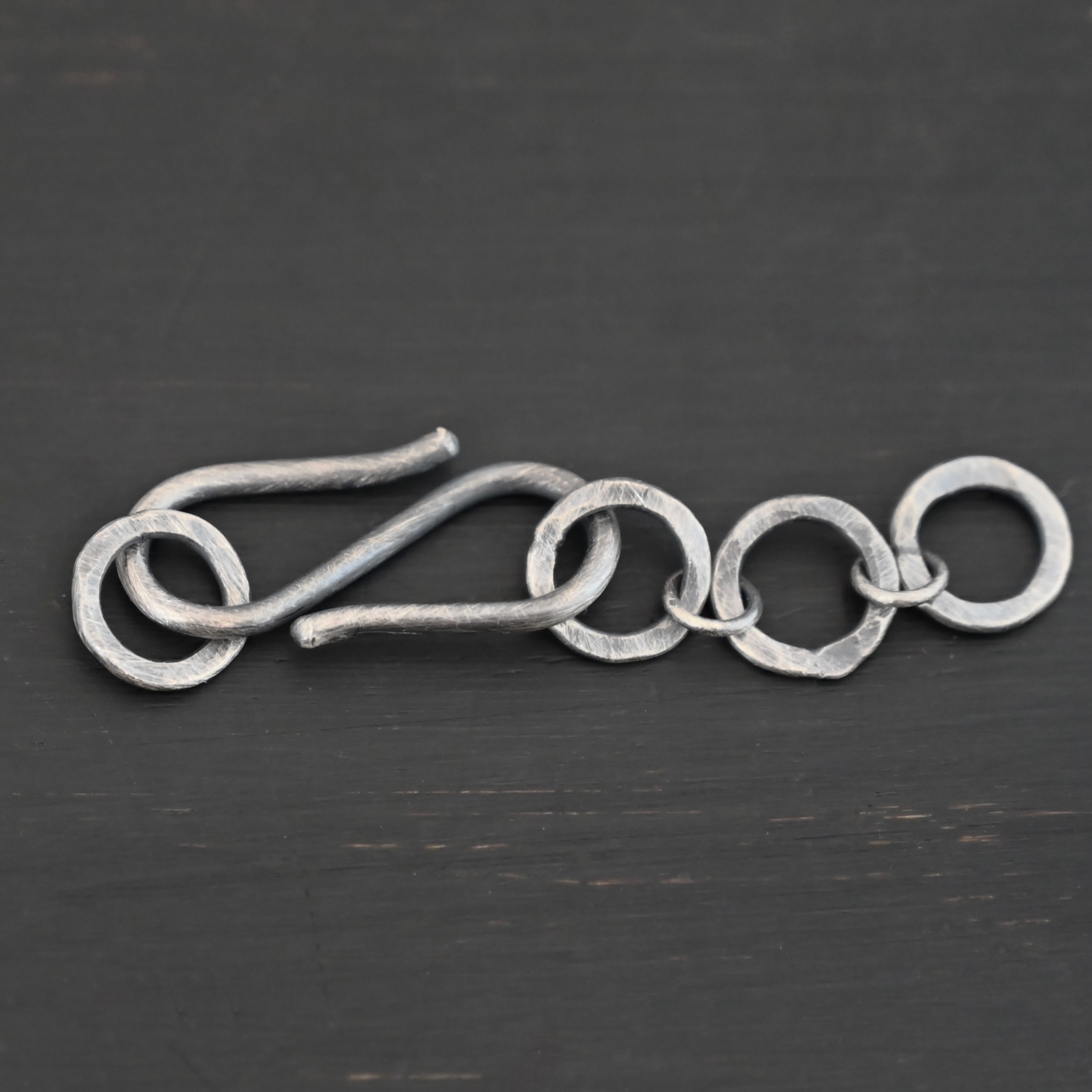 Ezra Extension - oxidized shown on dark background