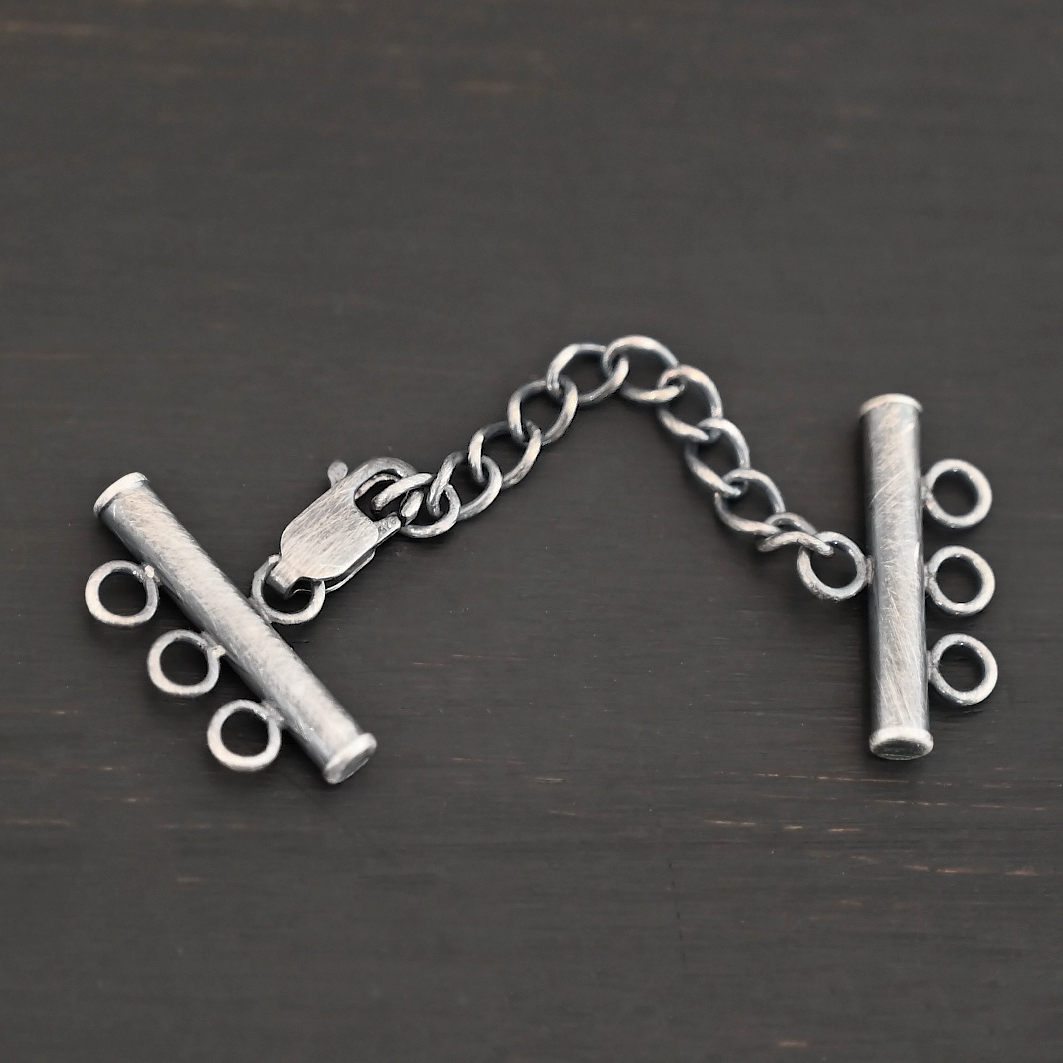 Maverick Extension - oxidized shown on dark background