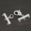 Molly CZ 3 strand clasp shown on dark background