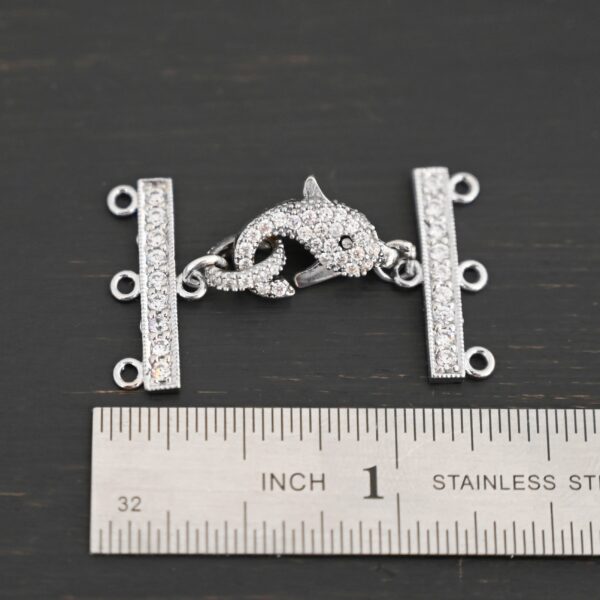 Molly CZ 3 strand clasp shown by ruler