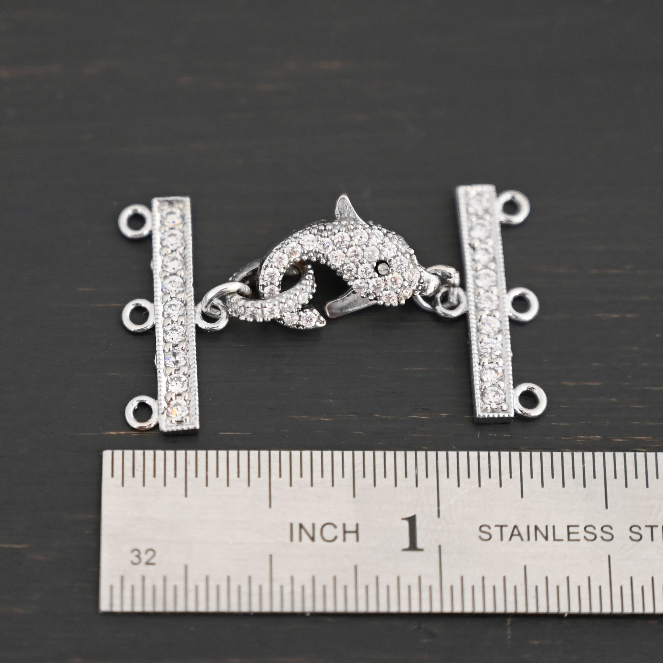 Molly CZ 3 strand clasp shown by ruler