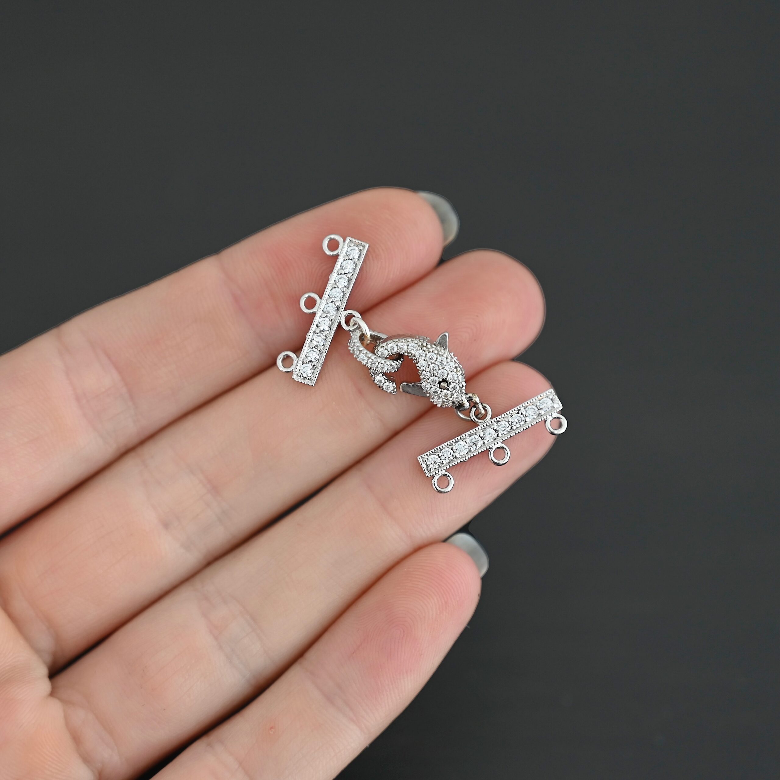 Molly CZ 3 strand clasp shown in hand