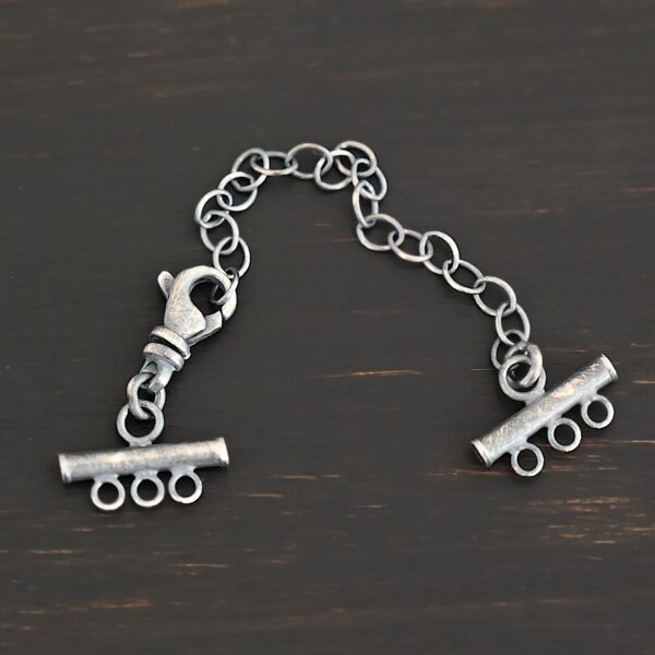Matthew multistrand clasp - oxidized 3 strand shown on dark background