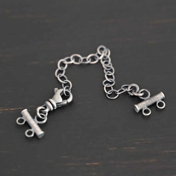 Matthew multistrand clasp - oxidized 2 strand shown on dark background