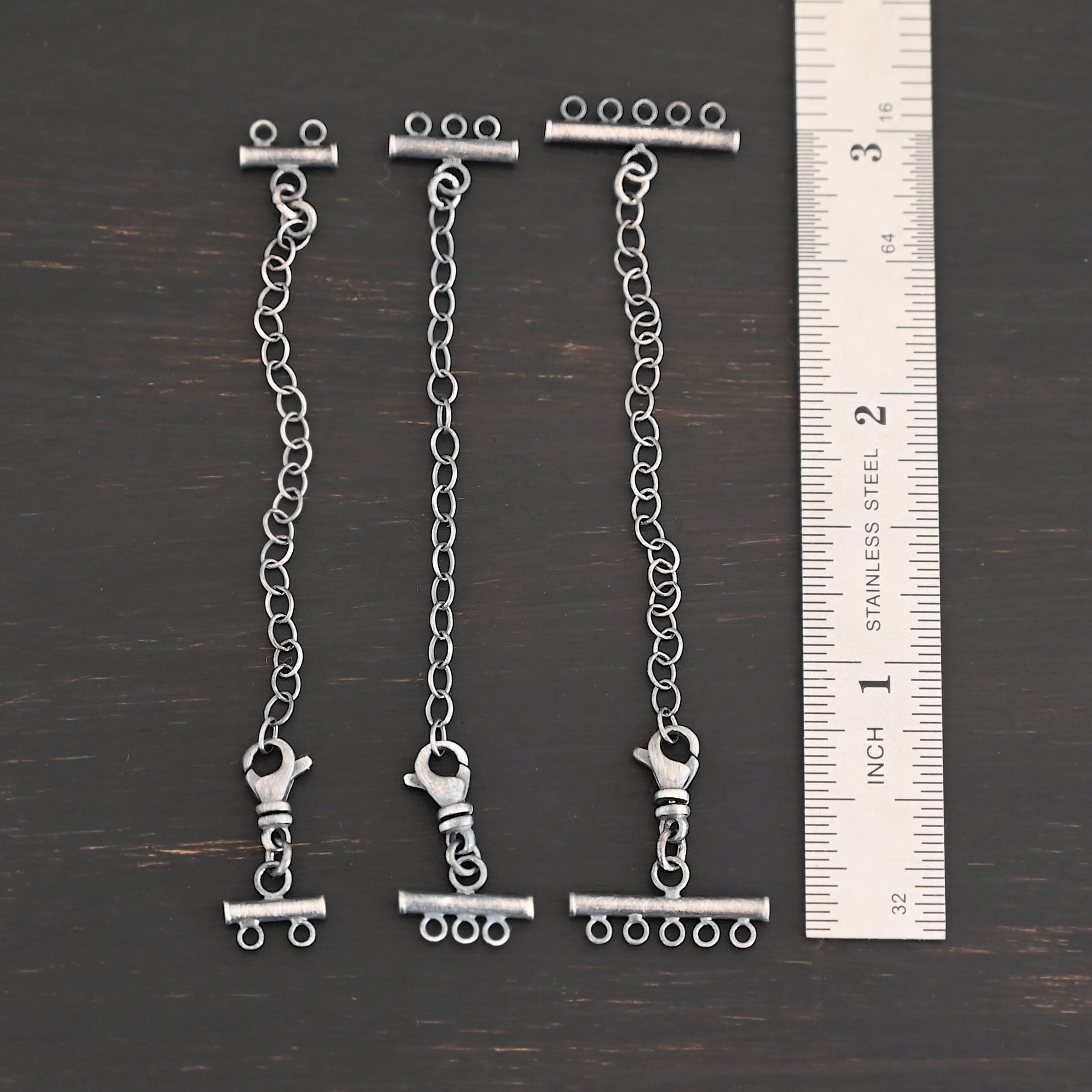 Matthew multistrand clasp - oxidized Matthew multistrand clasp - oxidized shown by ruler