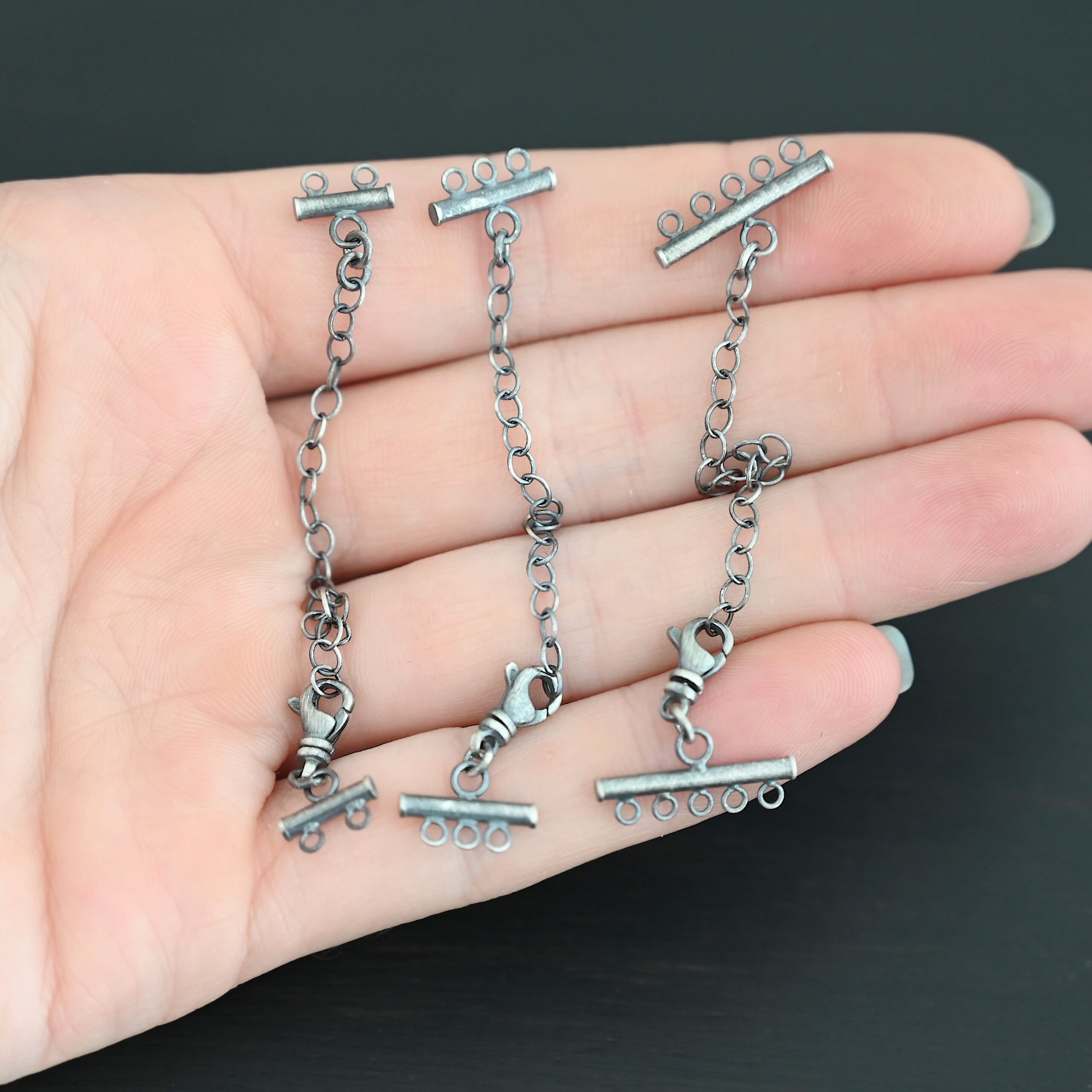 Matthew multistrand clasp - oxidized Matthew multistrand clasp - oxidized shown in hand