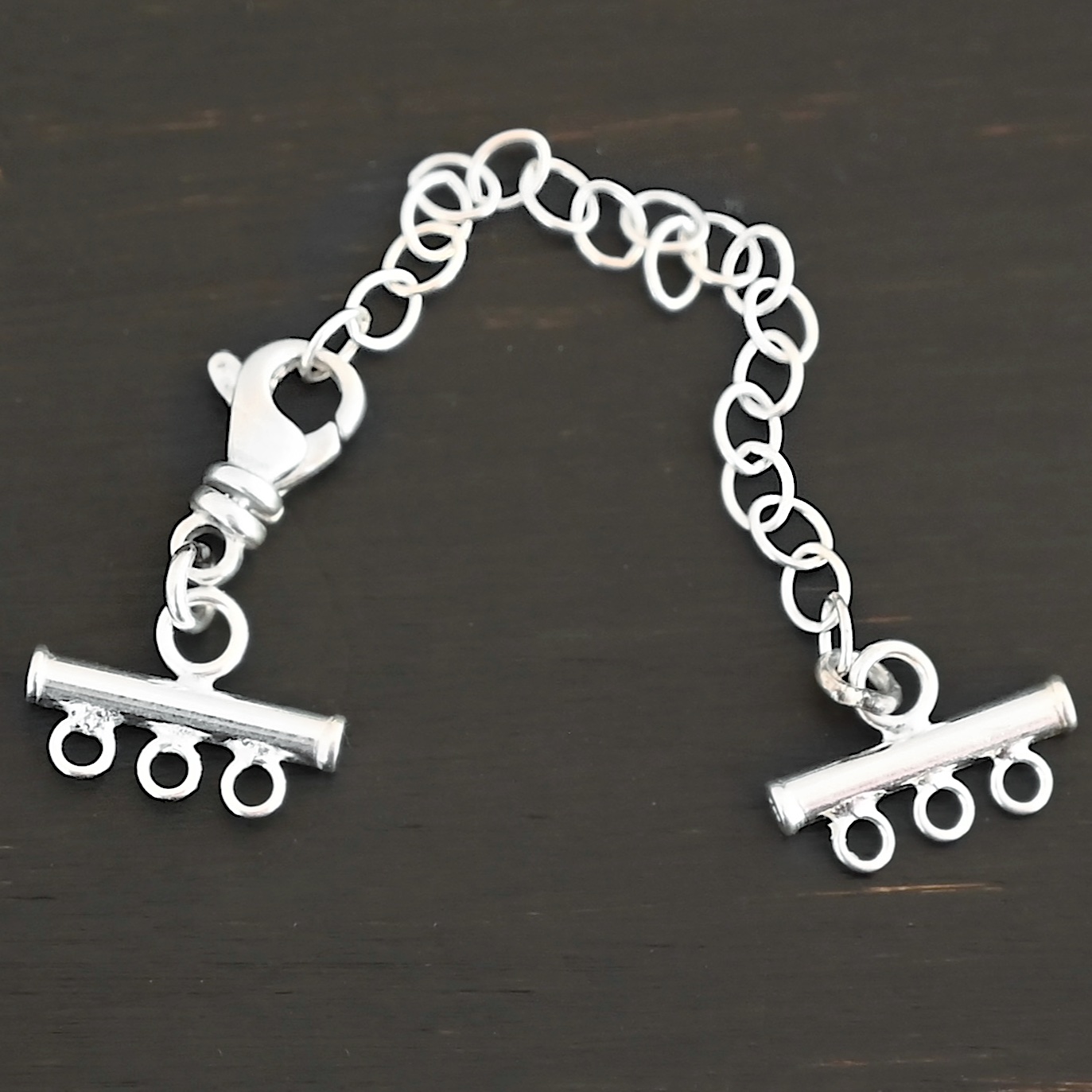 Matthew multistrand clasp - shiny 3 strand Matthew multistrand clasp - shiny 3 strand shown on dark background