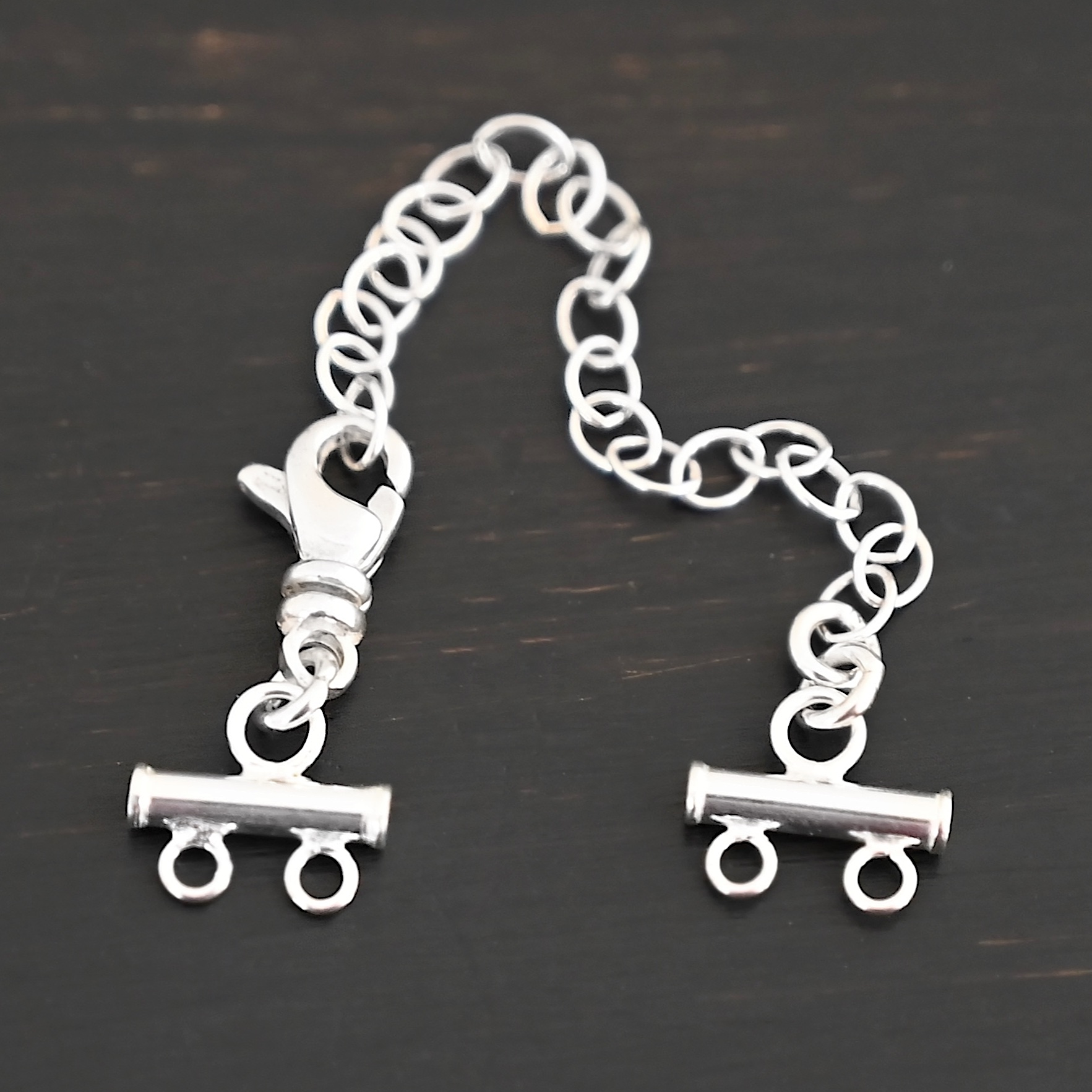 Matthew multistrand clasp - shiny 2 strand Matthew multistrand clasp - shiny 2 strand shown on dark background