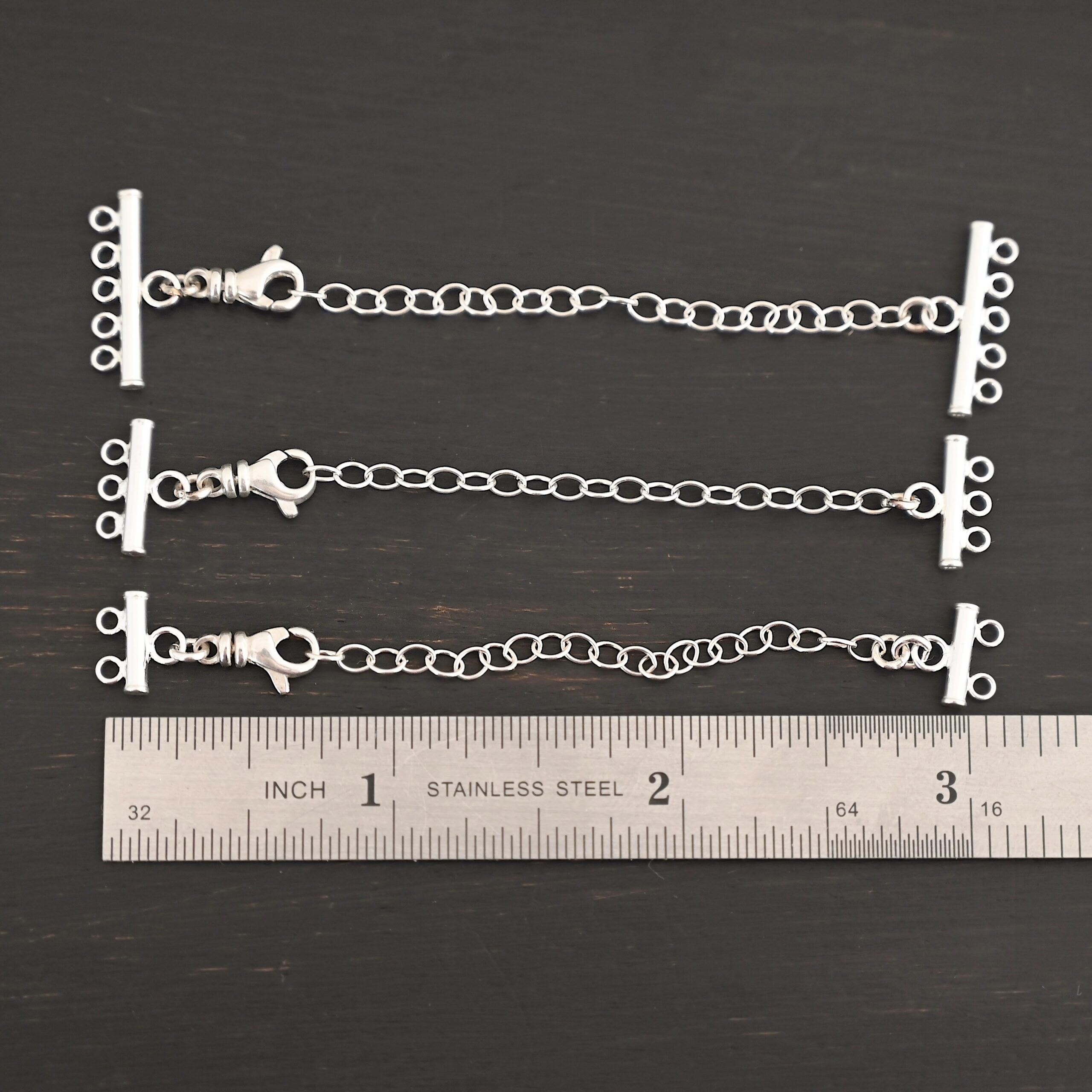 Matthew multistrand clasp - shiny Matthew multistrand clasp - shiny shown by ruler