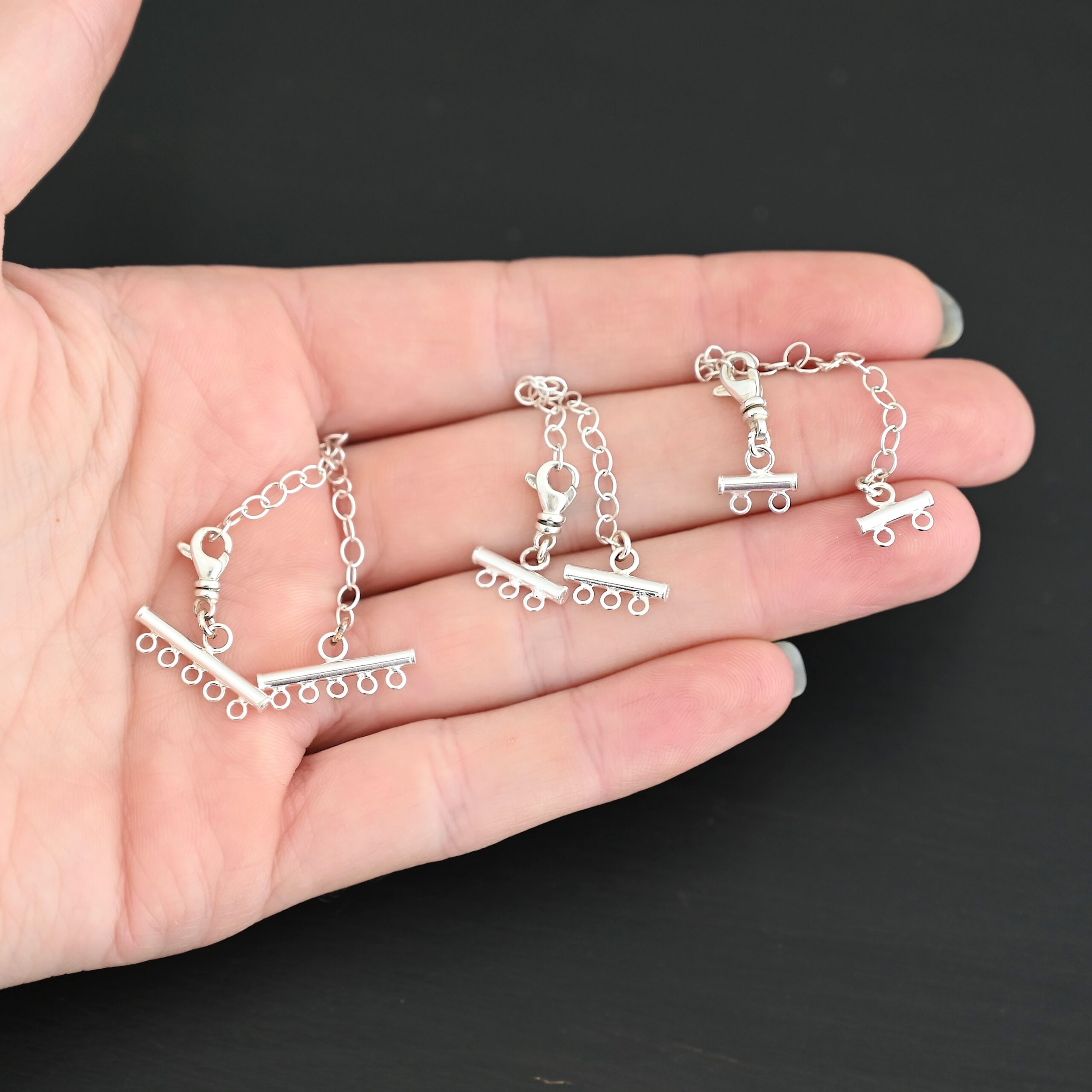 Matthew multistrand clasp - shiny Matthew multistrand clasp - shiny shown in hand