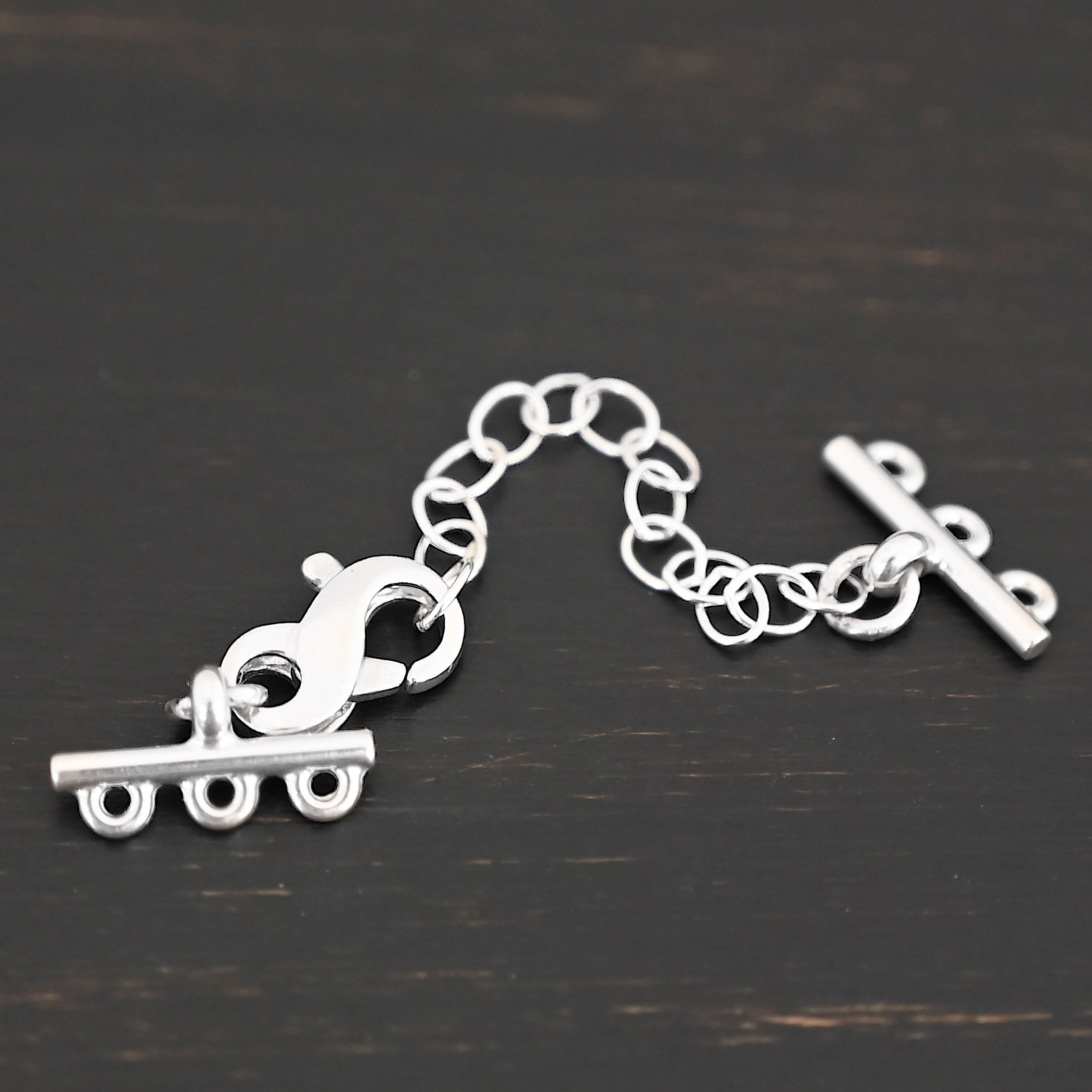 Max multistrand clasp - shiny 3 strand shown on dark background