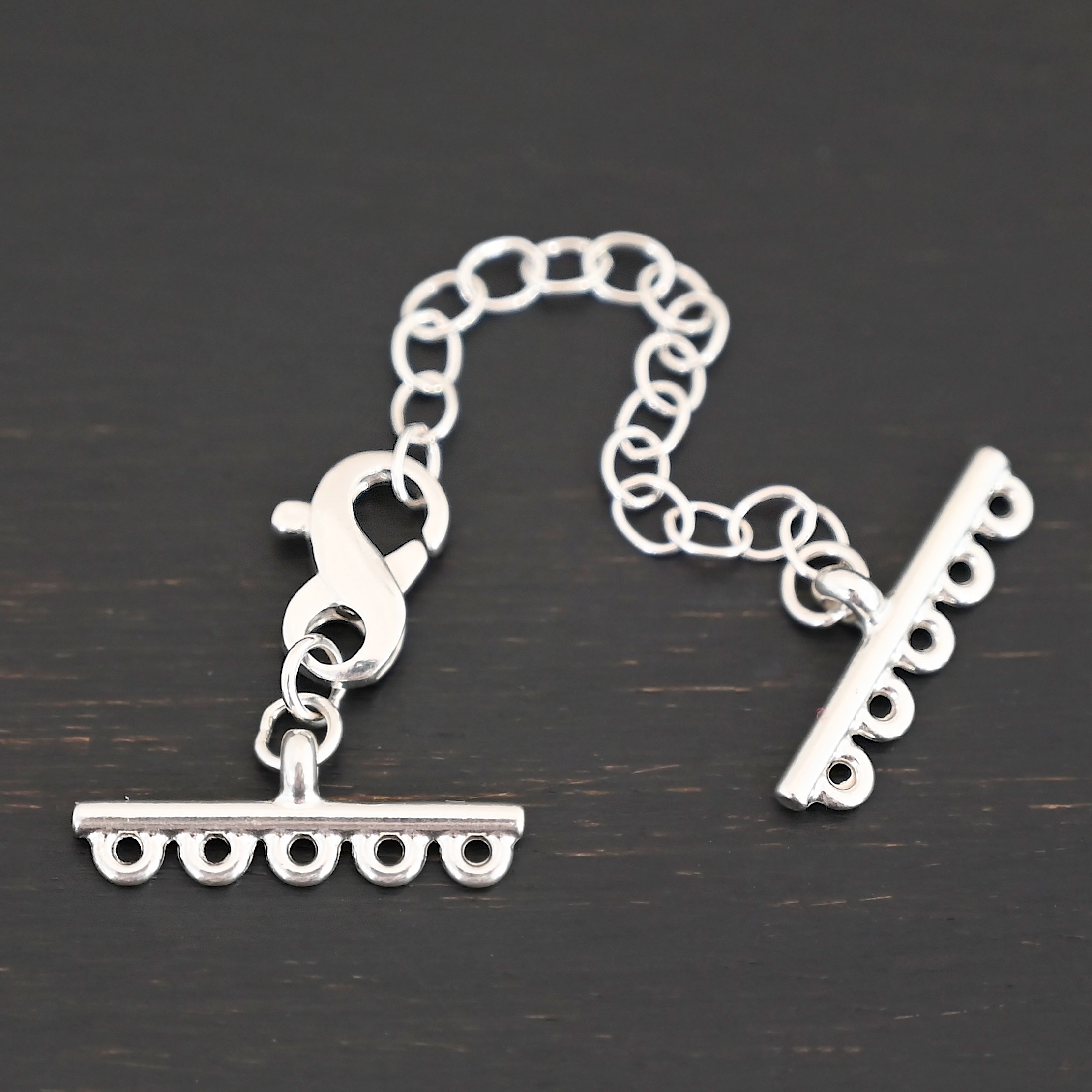 Max multistrand clasp - shiny 5 strand shown on dark background