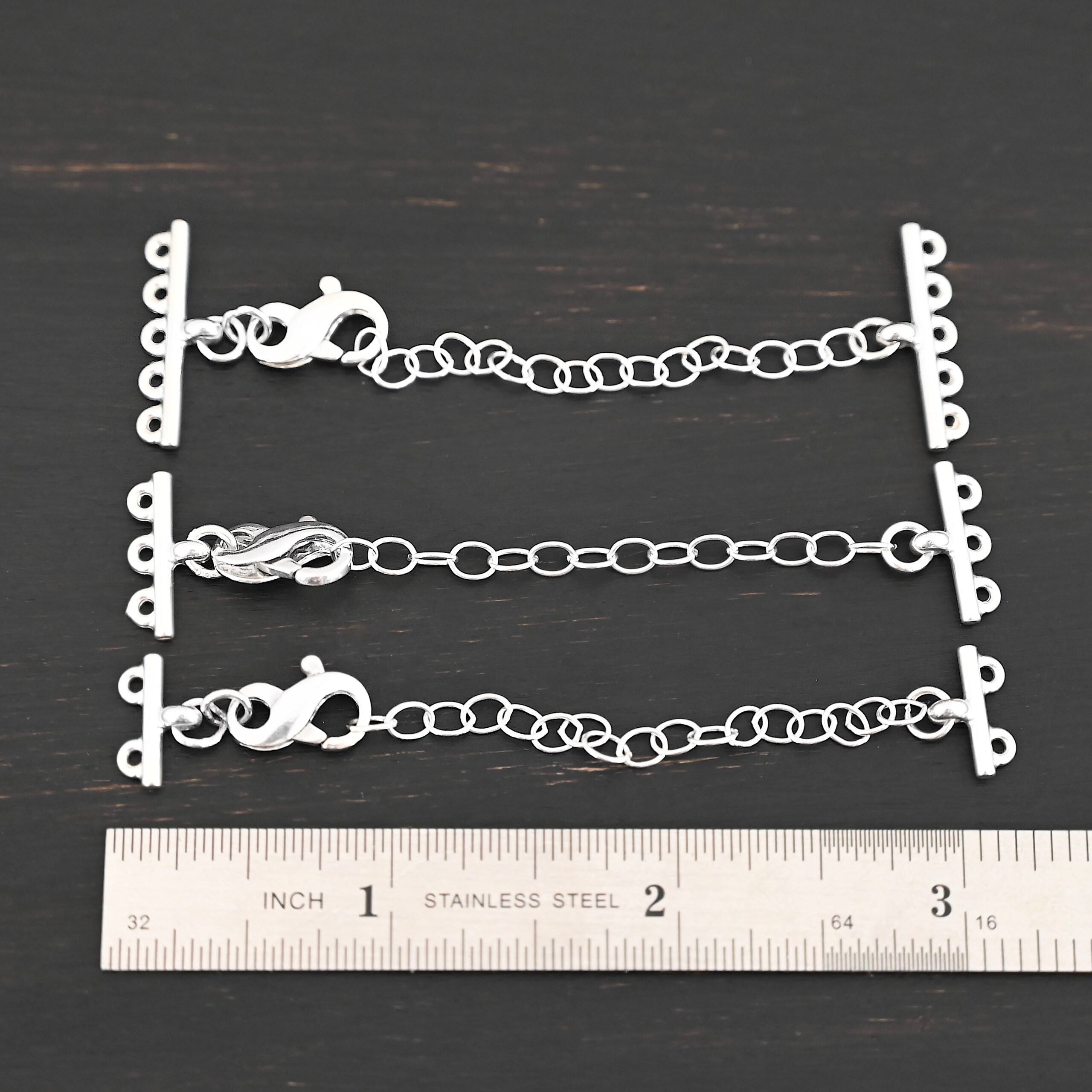 Max multistrand clasp - shiny shown by ruler