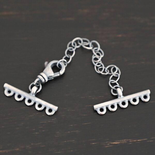Myles multistrand clasp - oxidized 5 strand shown on dark background