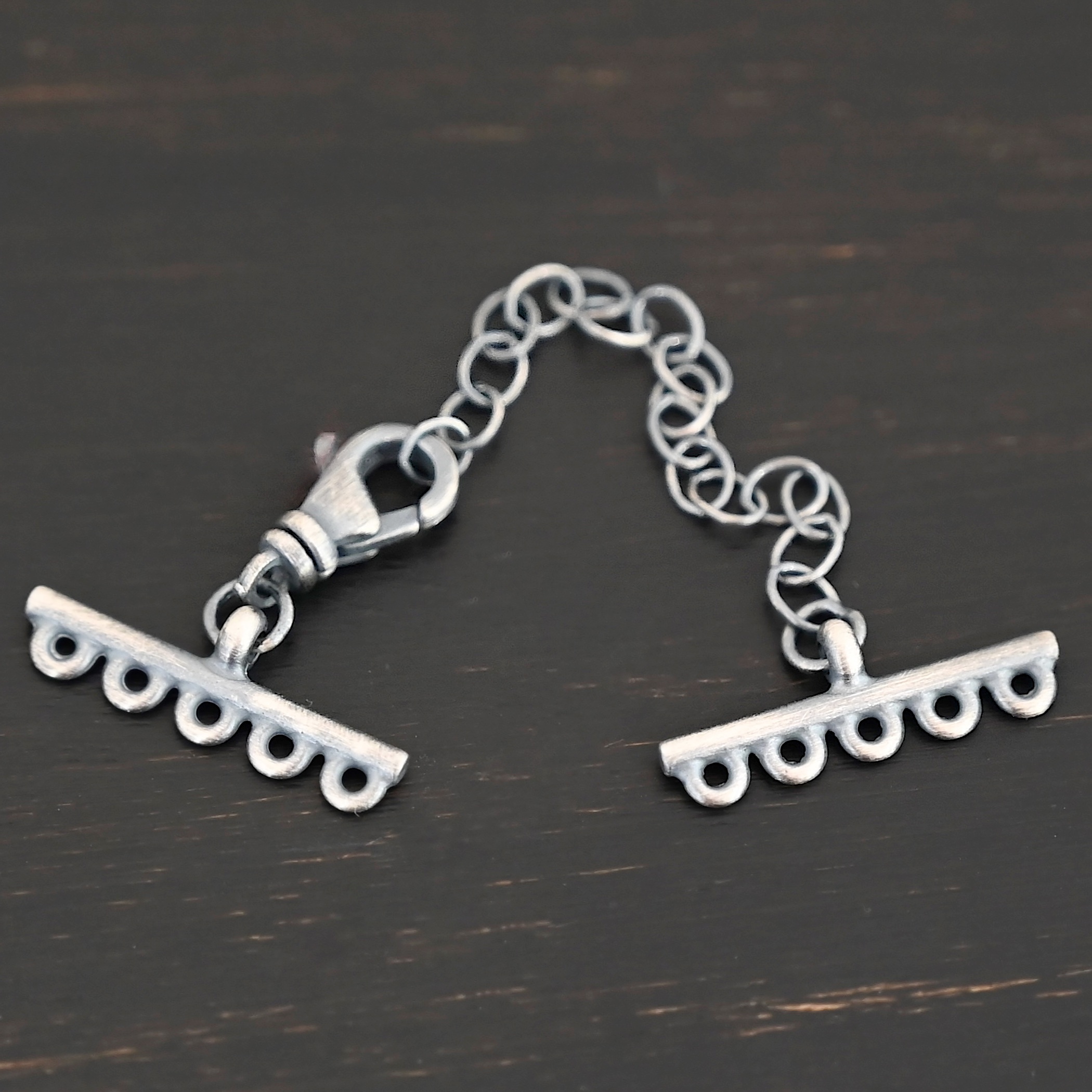 Myles multistrand clasp - oxidized 5 strand Myles multistrand clasp - oxidized 5 strand shown on dark background