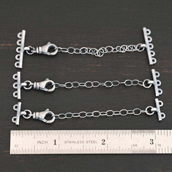 Myles multistrand clasp - oxidized shown by ruler