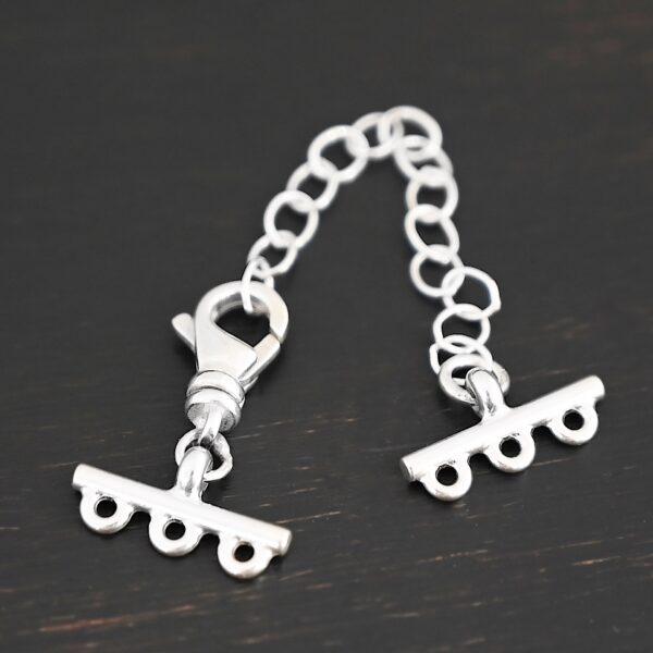 Myles multistrand clasp - shiny 3 strand shown on dark background
