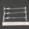 Myles multistrand clasp - shiny shown by ruler