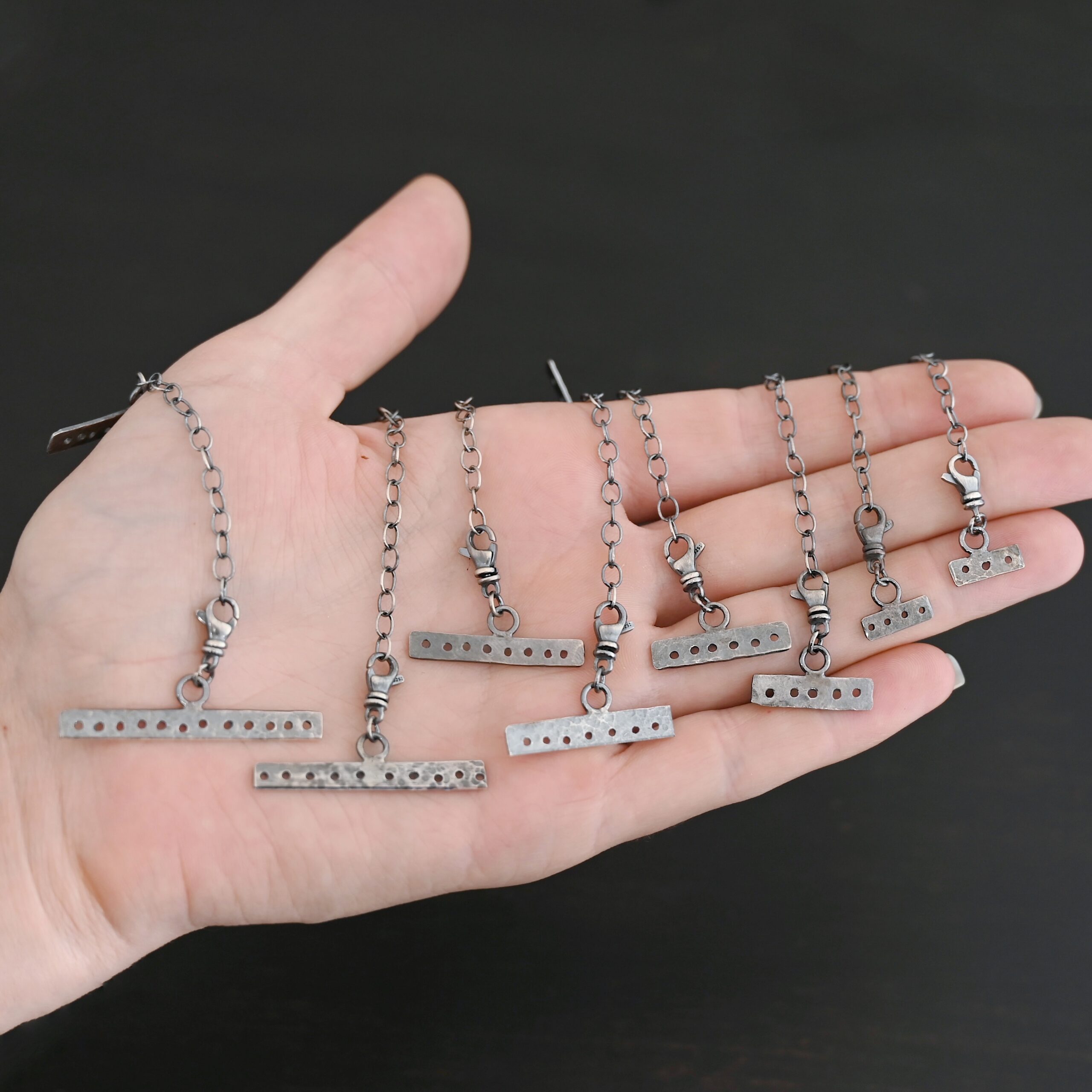 Mason multi strand clasp - oxidized shown in hand