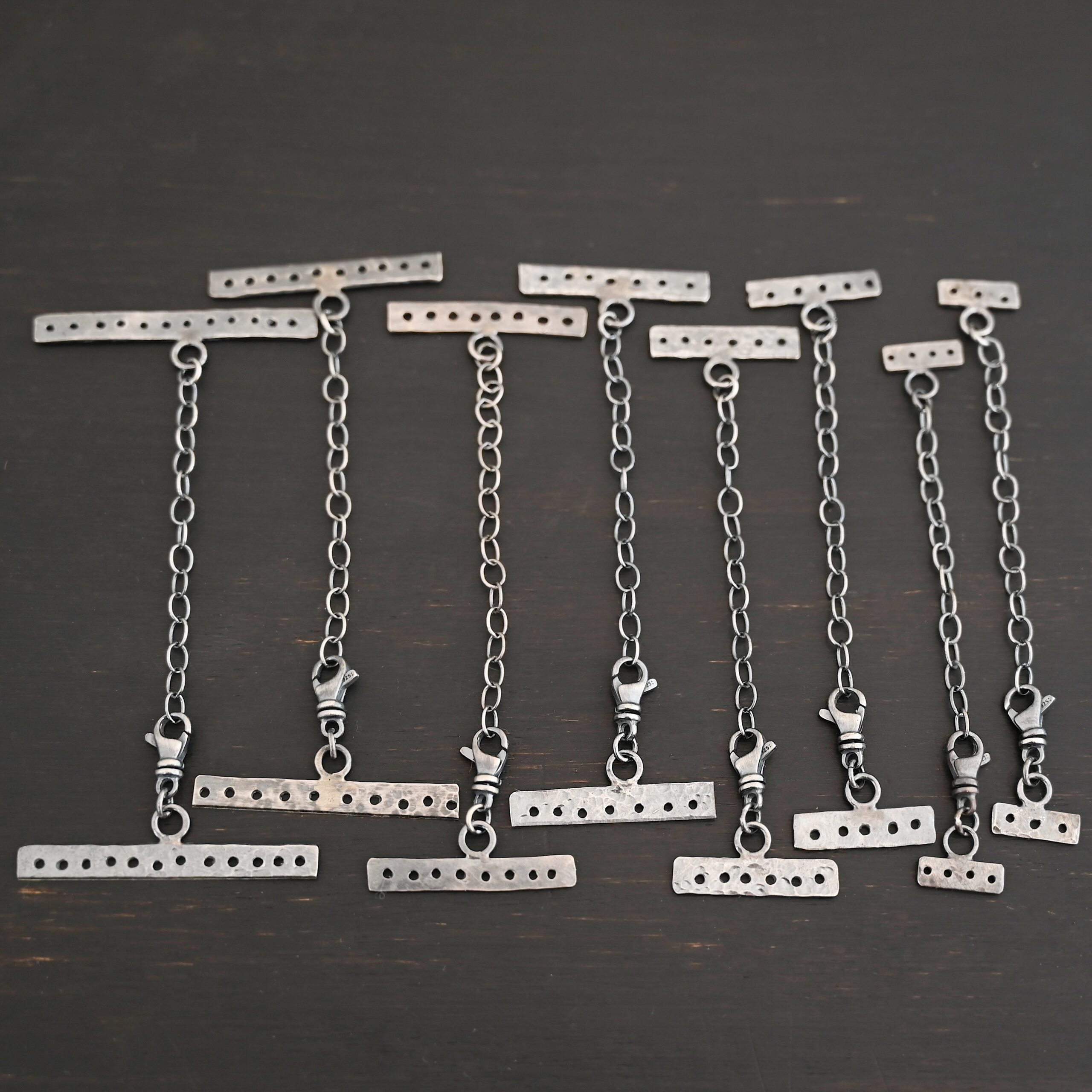 Mason multi strand clasp - oxidized on dark background