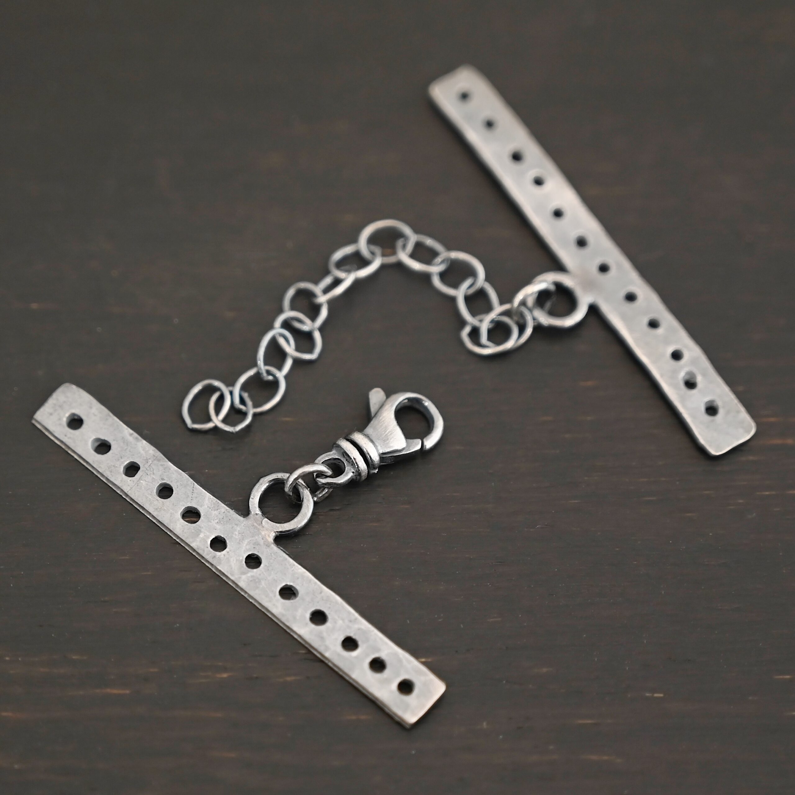 Mason multi strand clasp - oxidized 12 strand shown on dark background