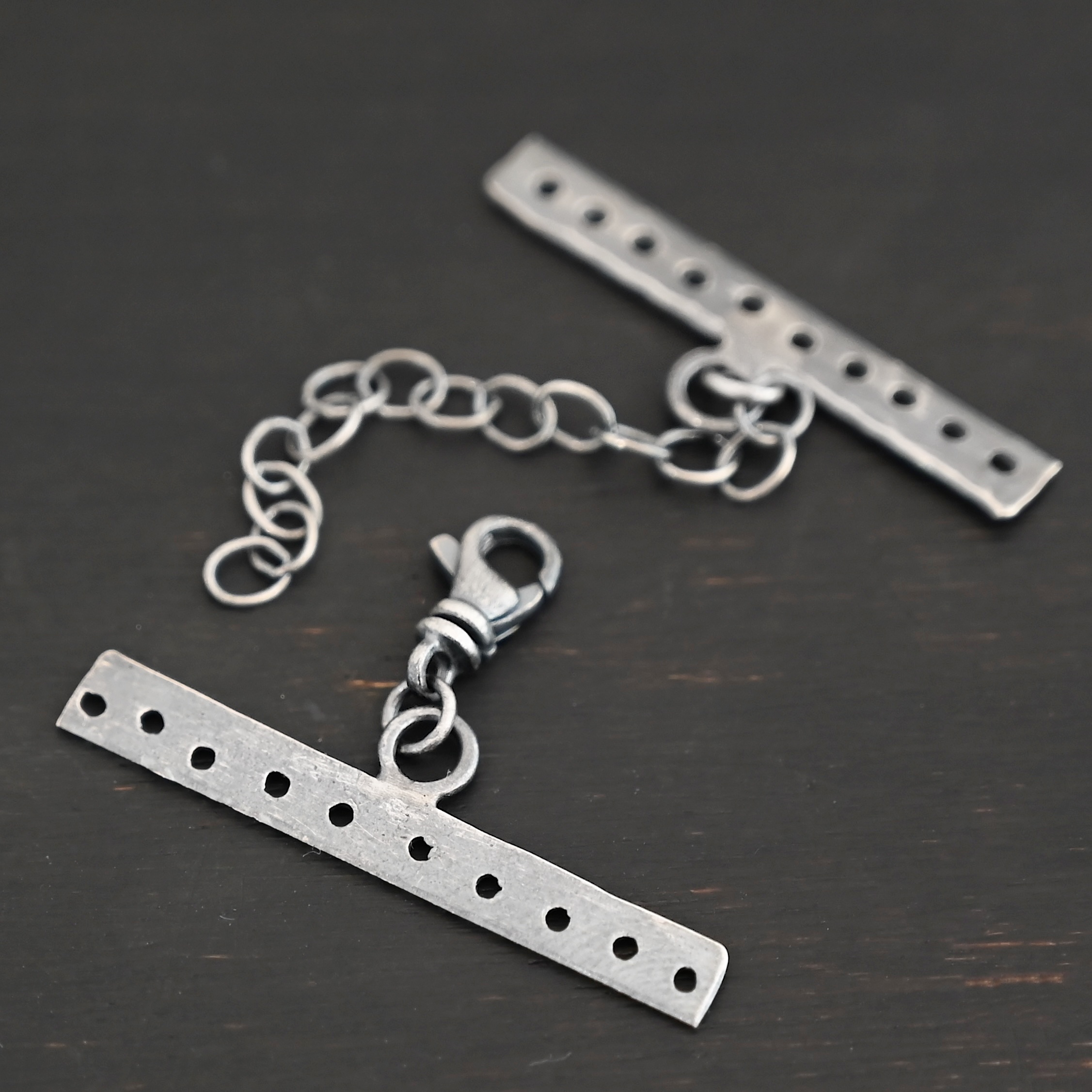 Mason multi strand clasp - oxidized 10 strand shown on dark background