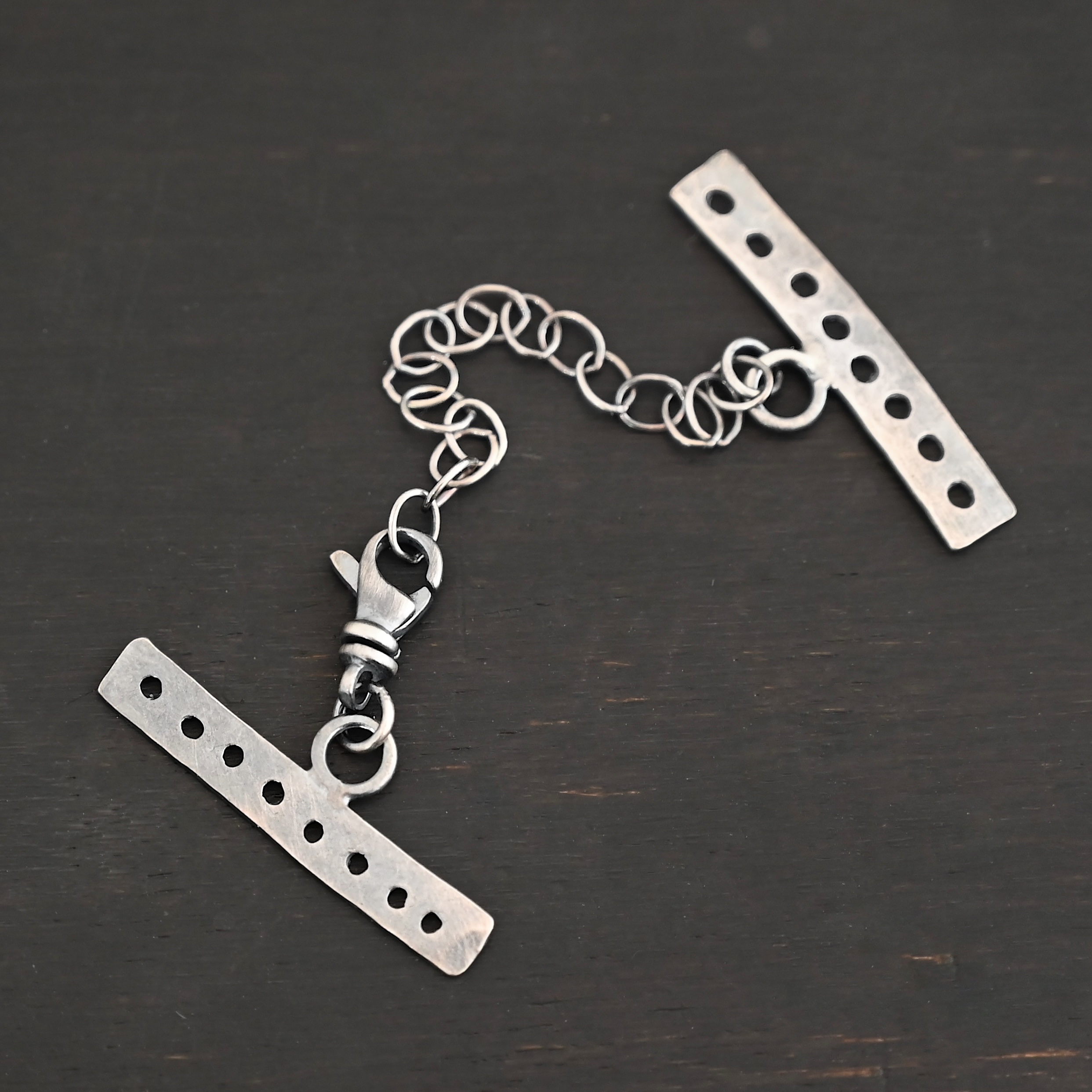 Mason multi strand clasp - oxidized 8 strand shown on dark background