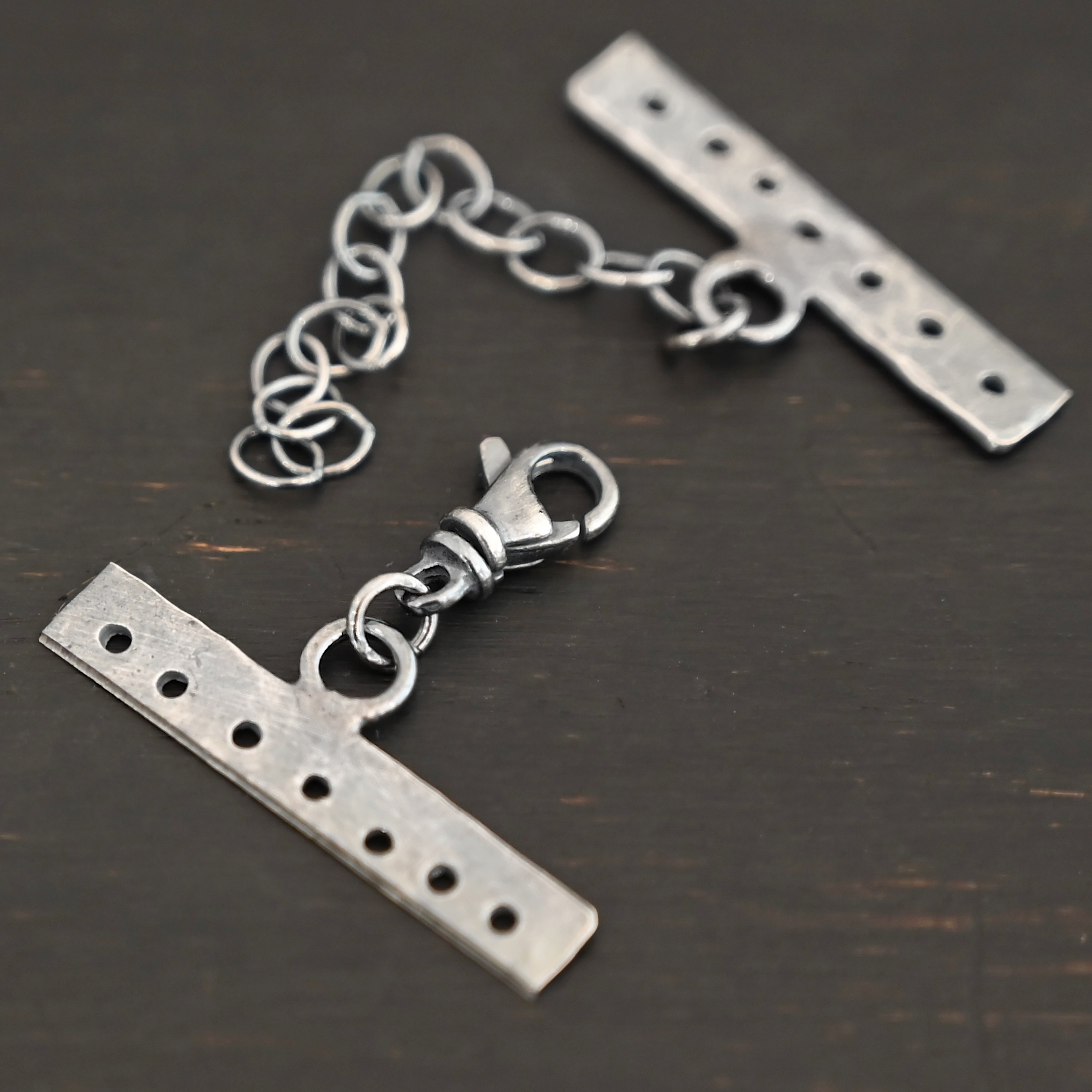 Mason multi strand clasp - oxidized 7 strand shown on dark background