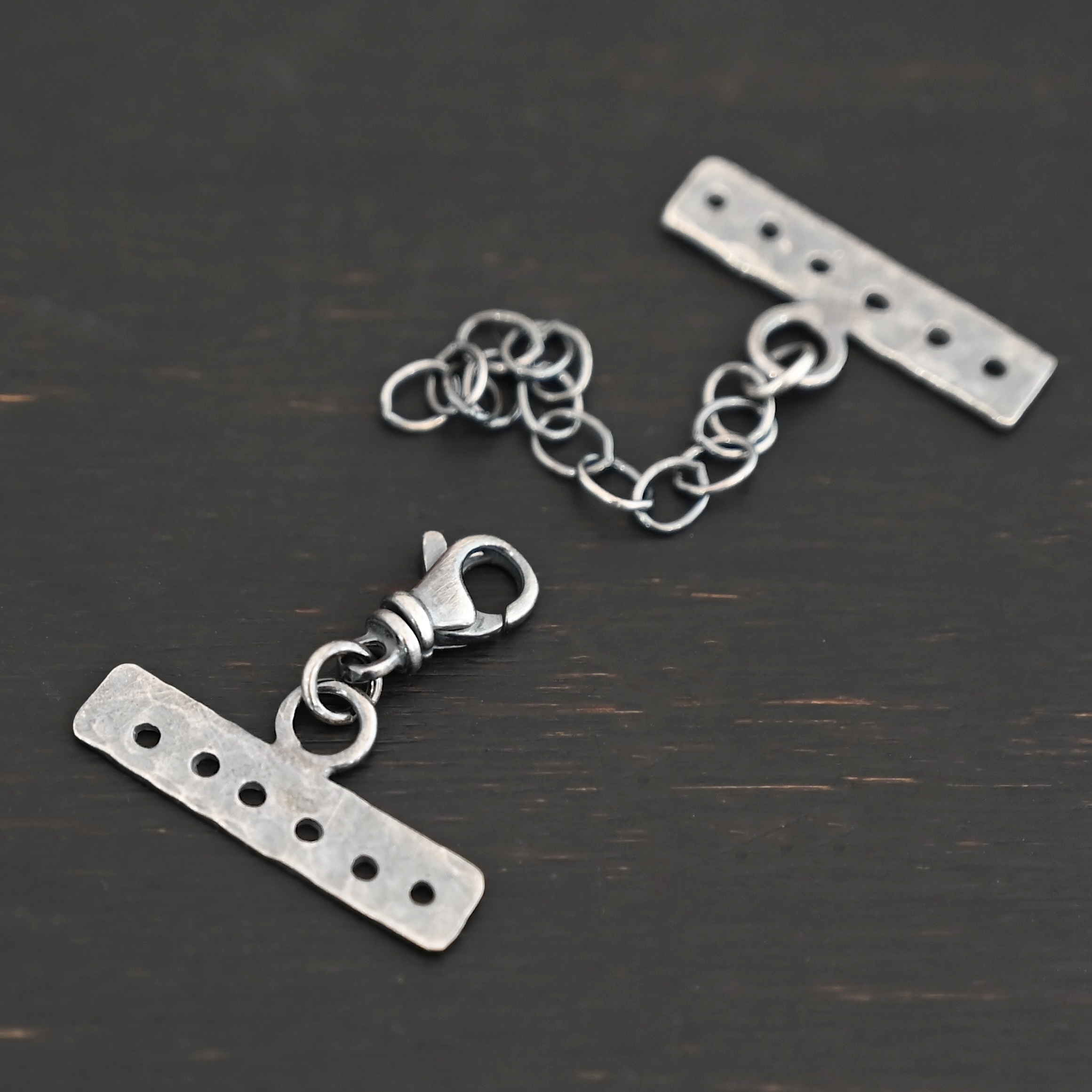 Mason multi strand clasp - oxidized 6 strand shown on dark background