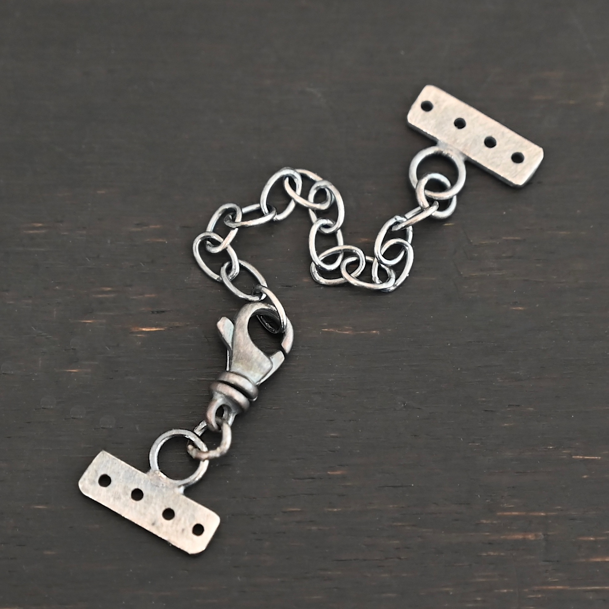Mason multi strand clasp - oxidized 4 strand shown on dark background