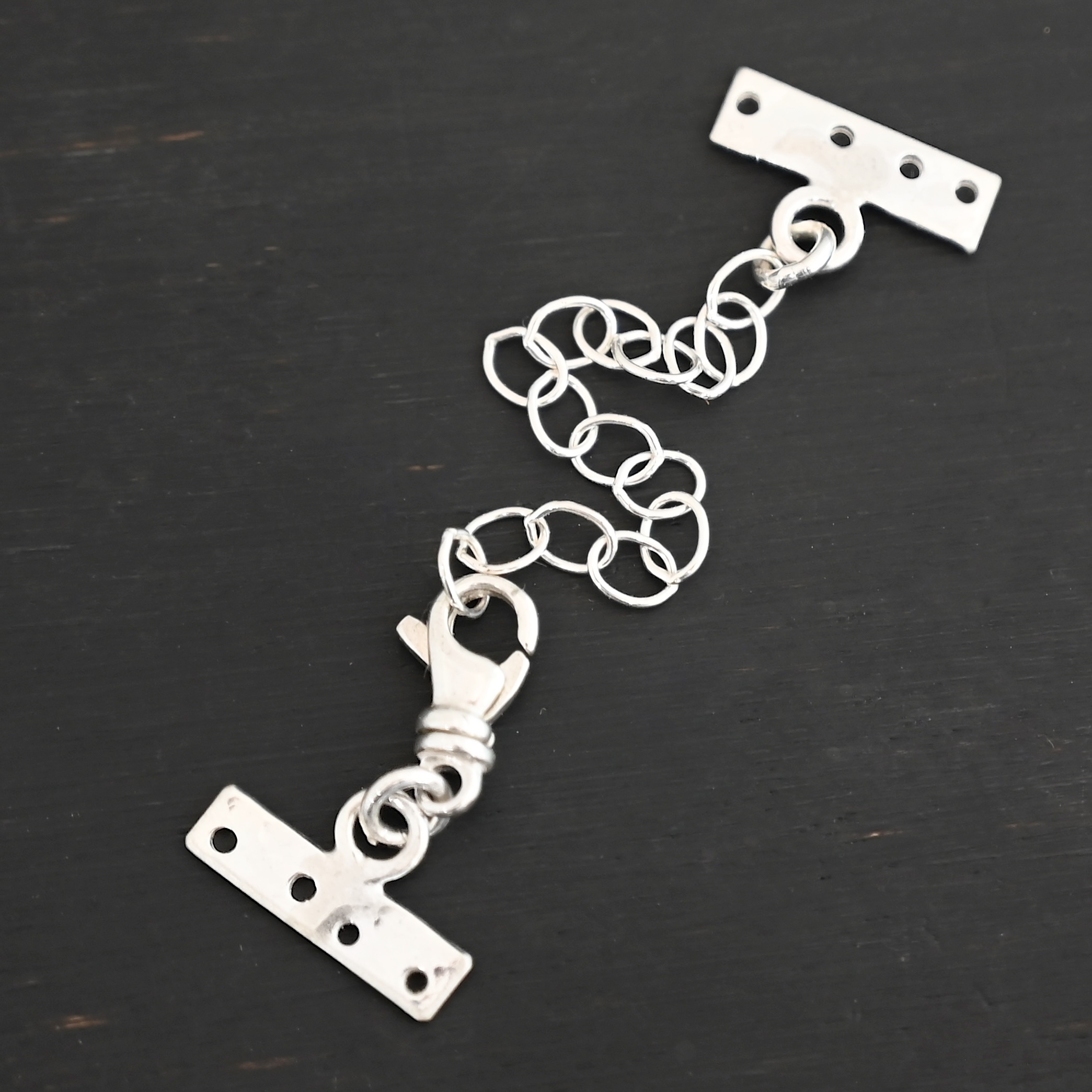 Mason multi strand clasp - shiny 4 strand shown on dark background