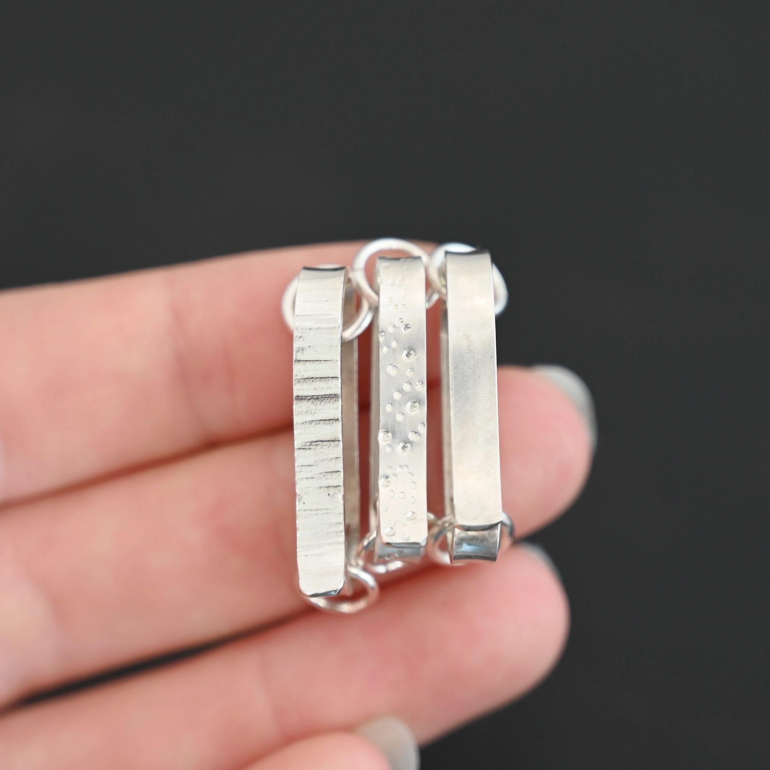 Hank Hook Clasp - shiny Hank Hook Clasp - shiny shown in hand