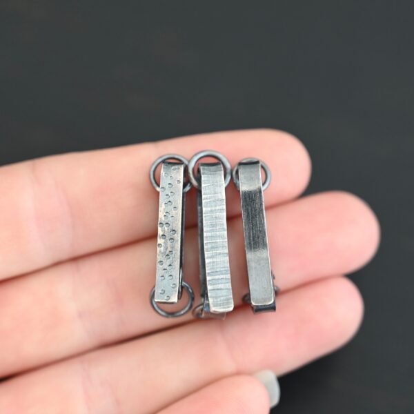 Hank Hook Clasp - oxidized shown in hand