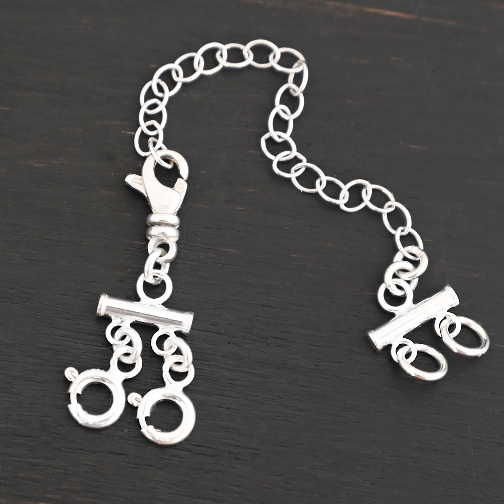 Matthew Multi strand necklace extender - shiny 2 strand shown on dark background