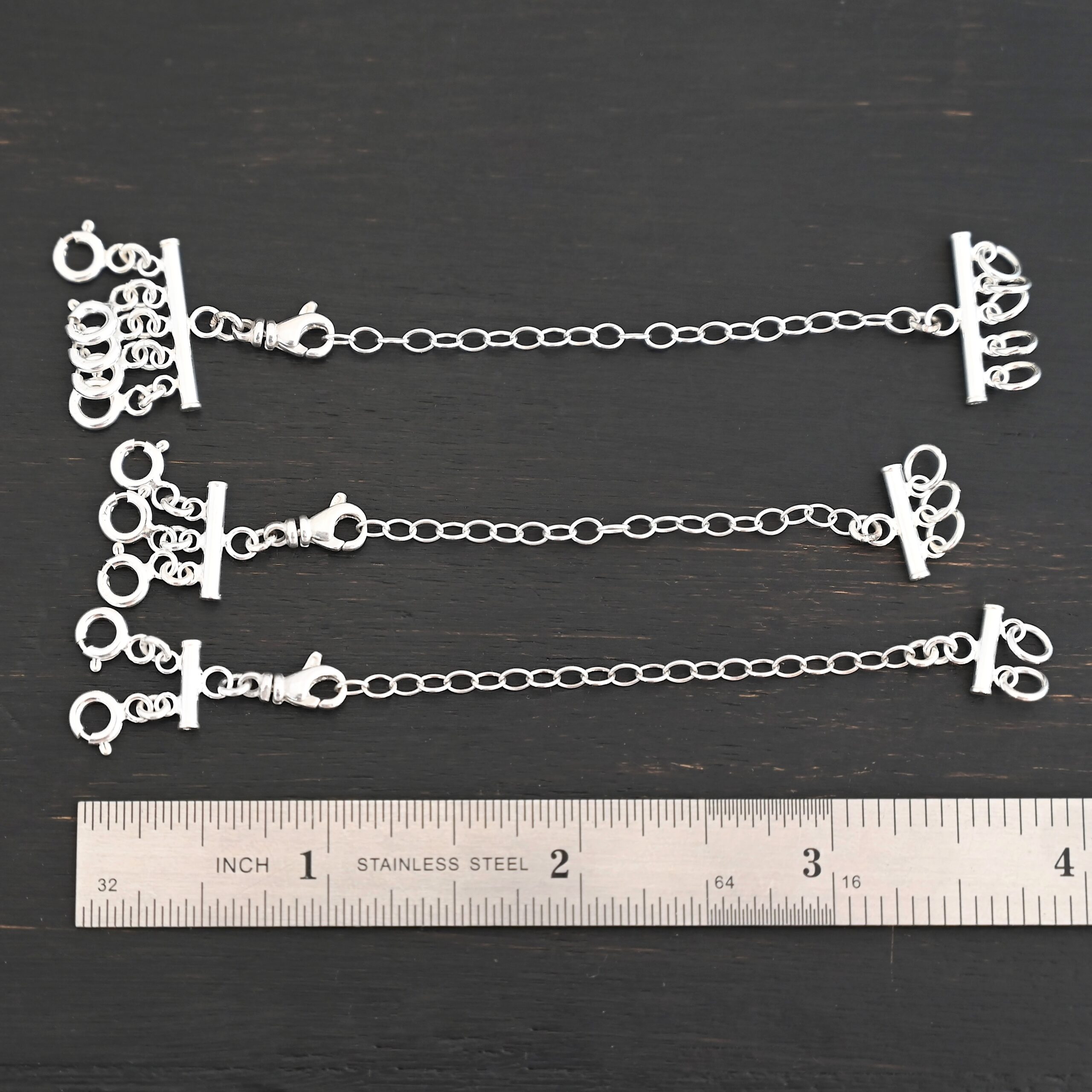 Matthew Multi strand necklace extender - shiny shown by ruler