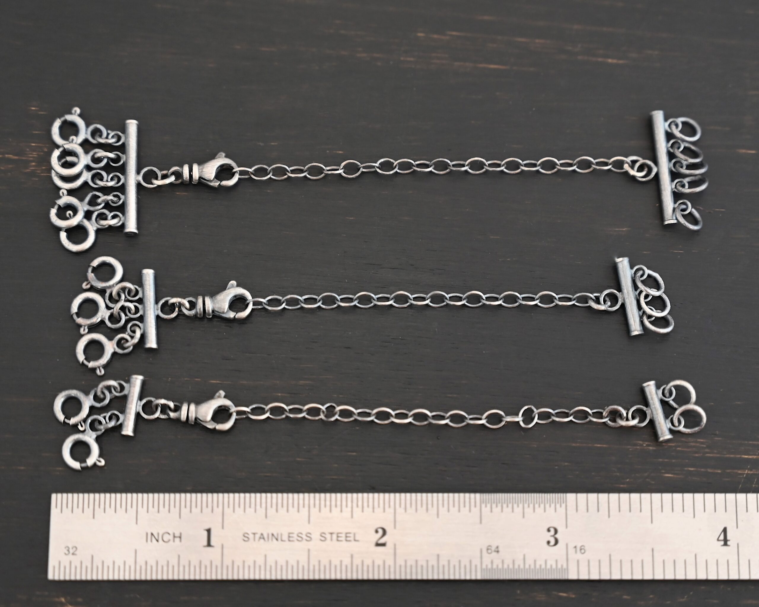 Matthew Multi strand necklace extender - oxidized shown by ruler