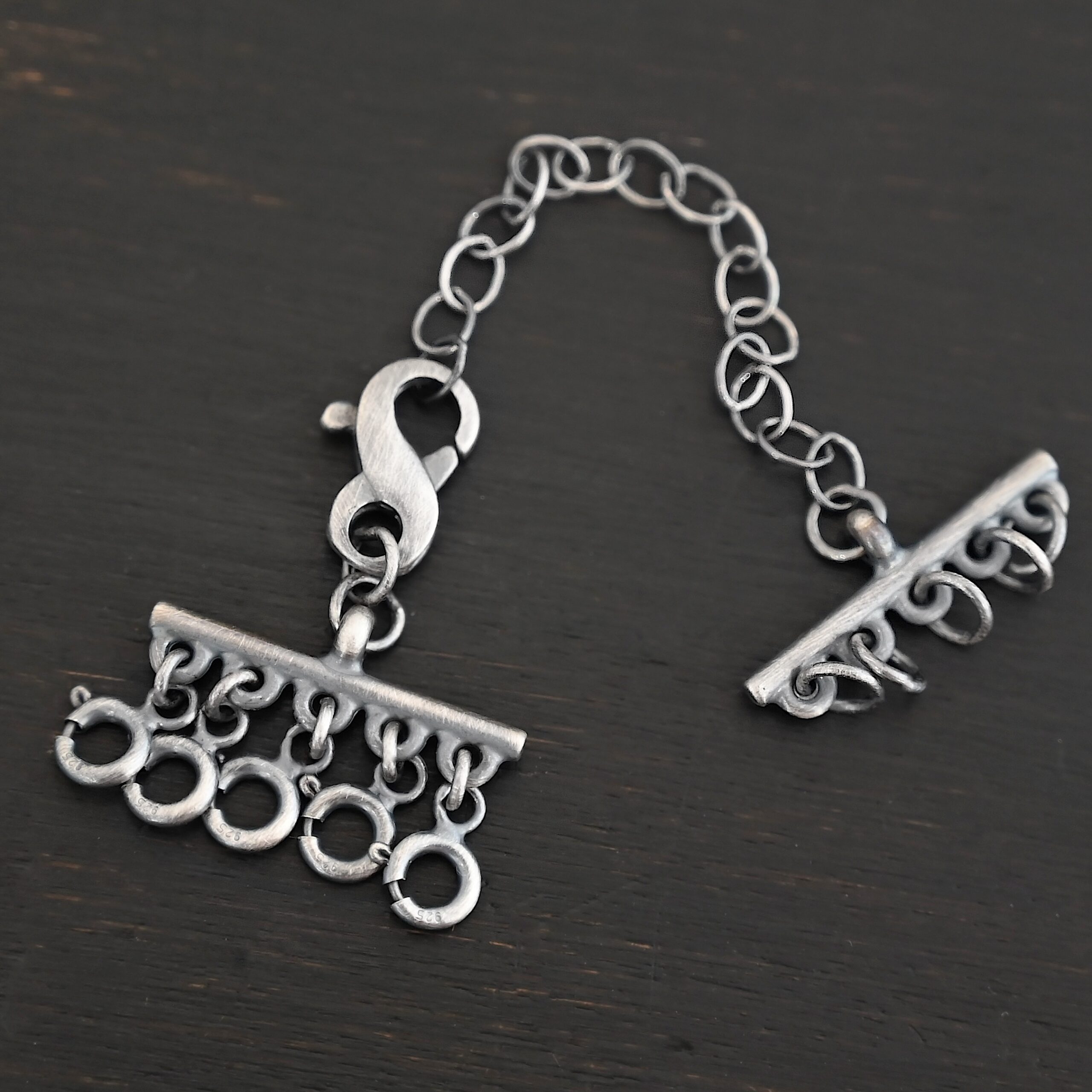 Max Multi strand necklace extender - oxidized 5 strand shown on dark background