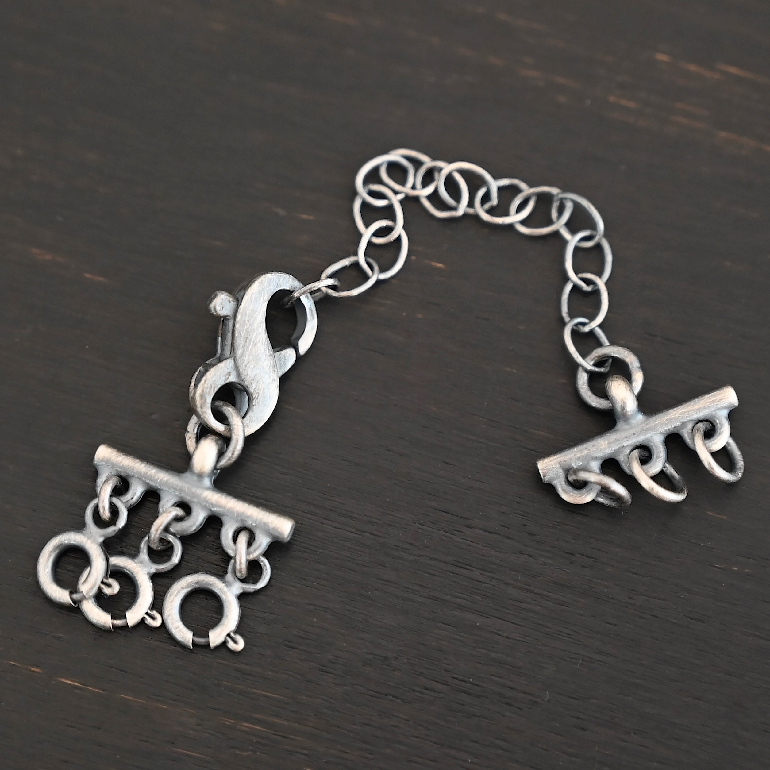 Max Multi strand necklace extender - oxidized 3 strand shown on dark background