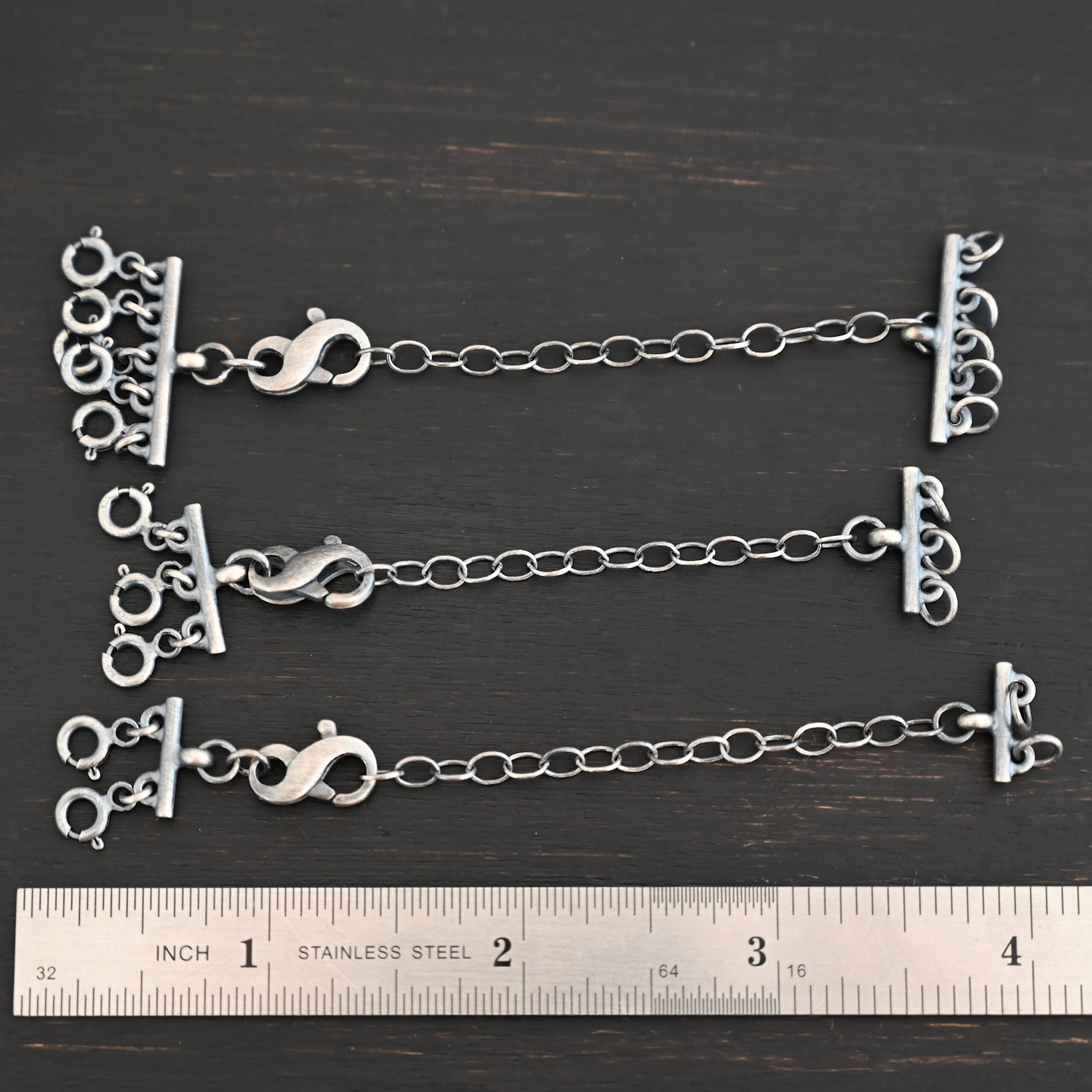 Max Multi strand necklace extender - oxidized shown by ruler