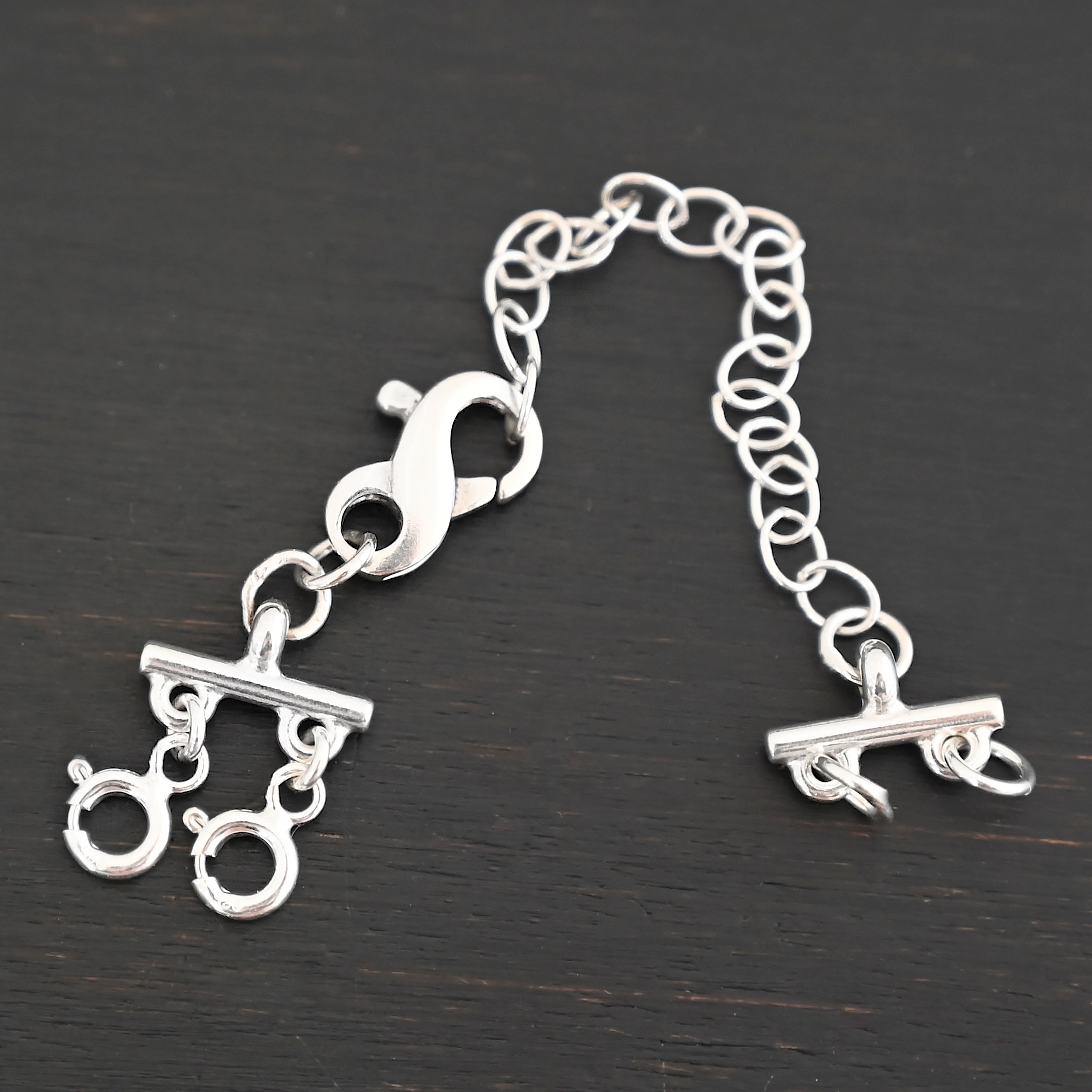 Max Multi strand necklace extender - shiny 2 strand shown on dark background