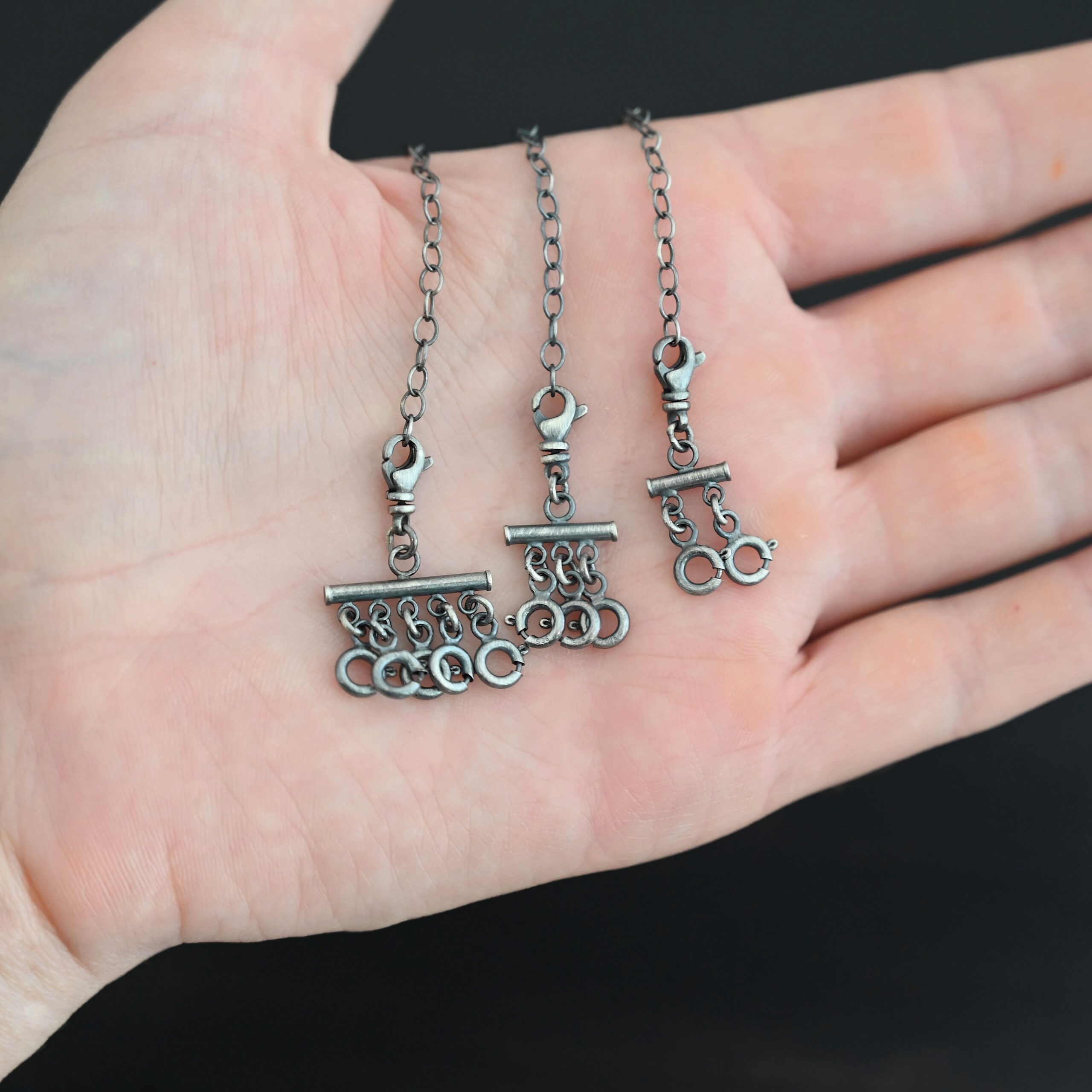 Matthew Multi strand necklace extender - oxidized shown in hand