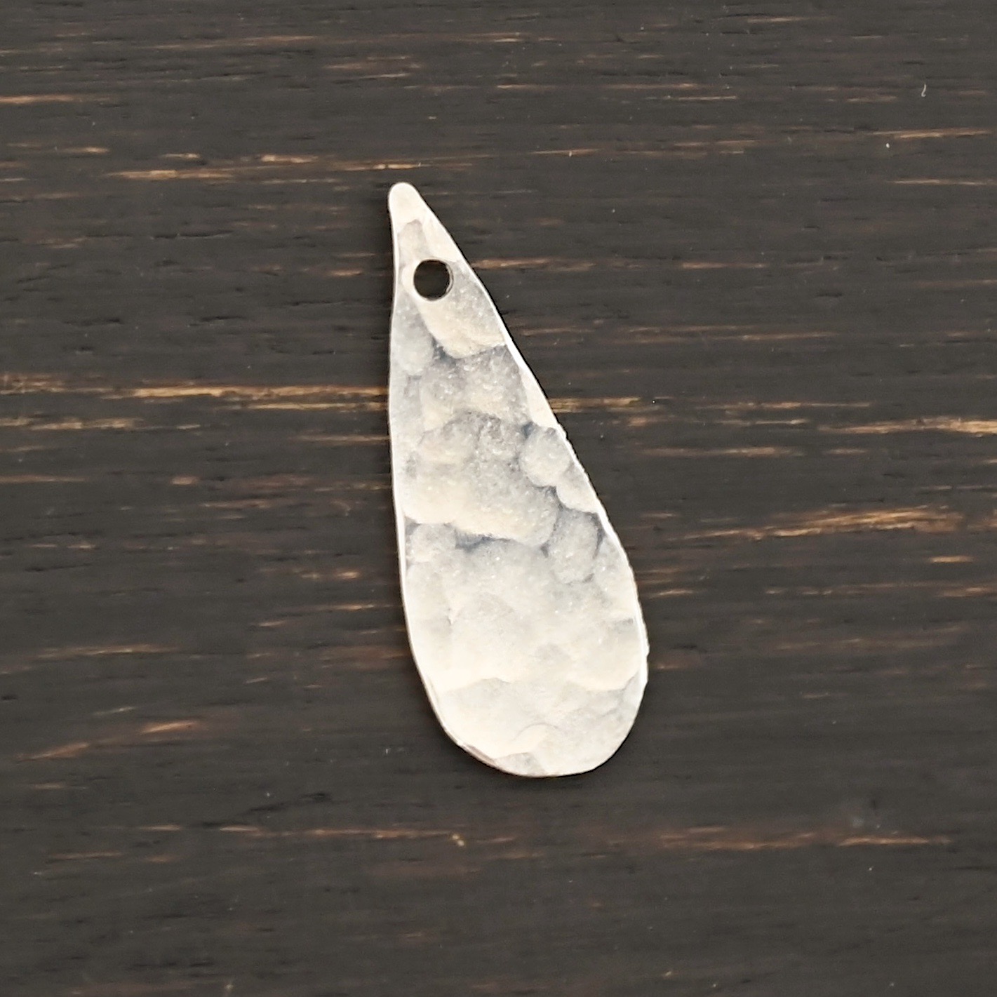 Sterling Silver Teardrop Blank - shiny hammered shown on dark background